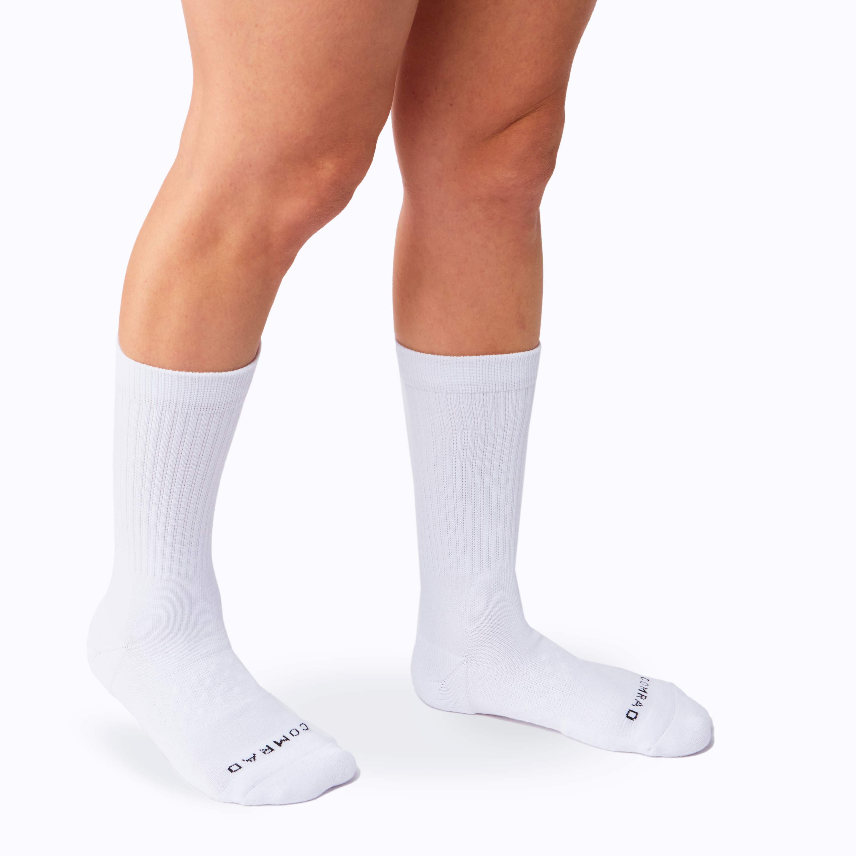 White socks worn by a person on a white background