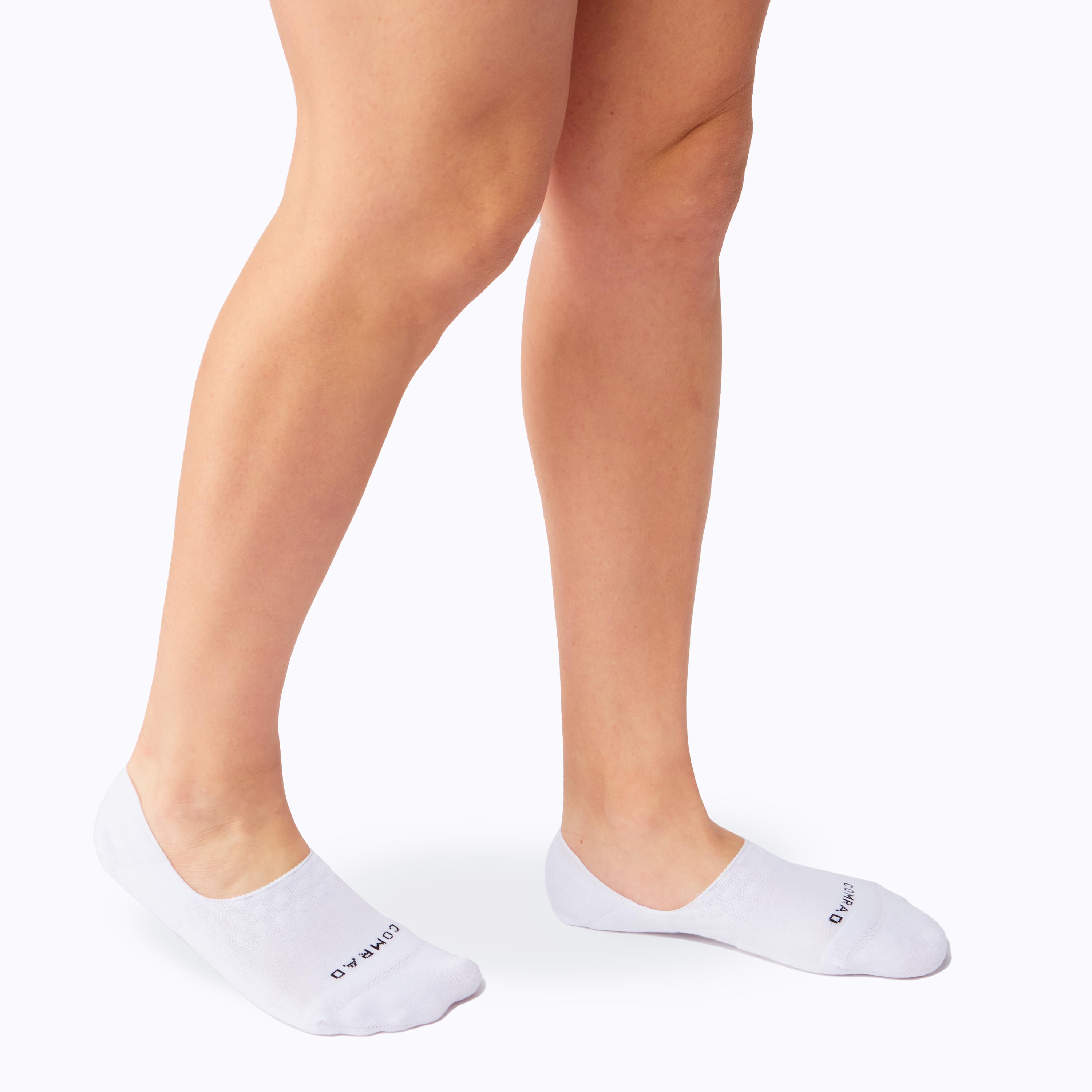 White socks worn with a plain background