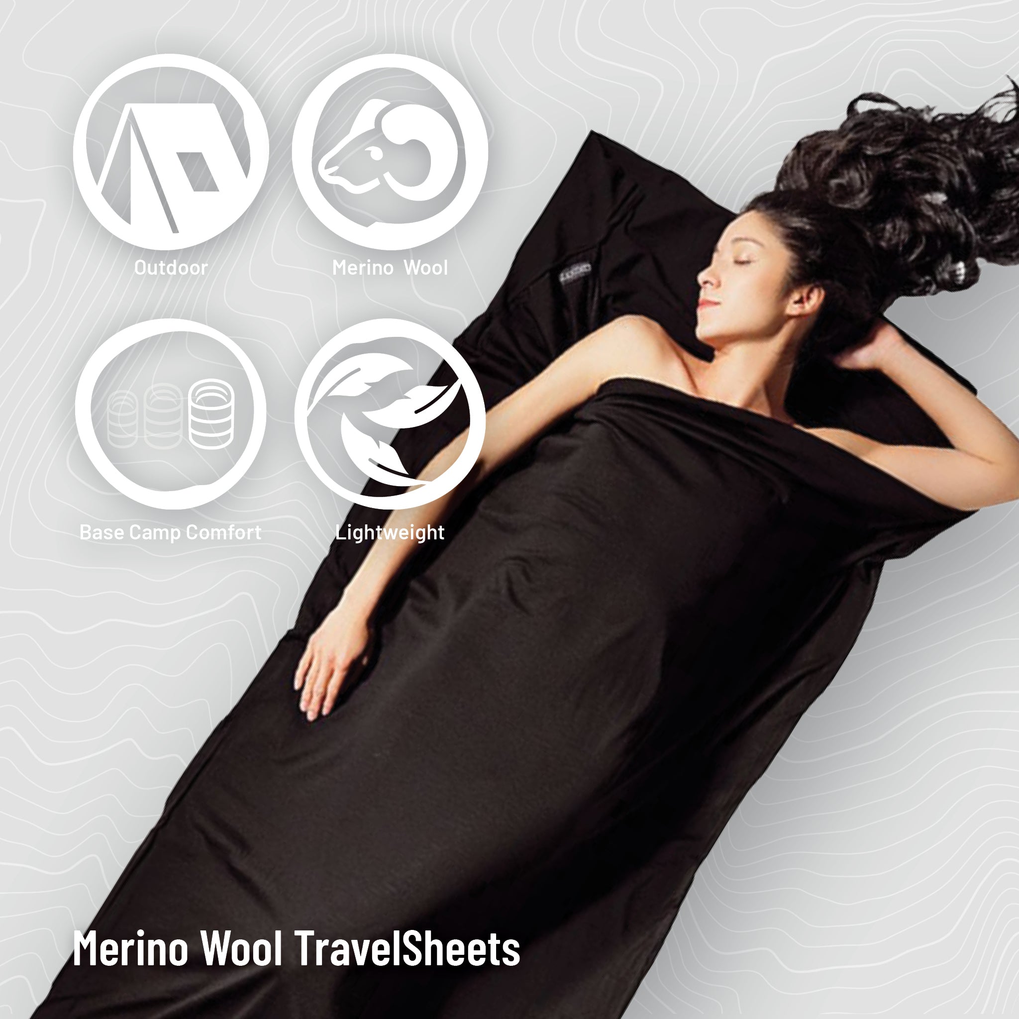 Person lying down wearing black Merino Wool TravelSheets with feature icons above.