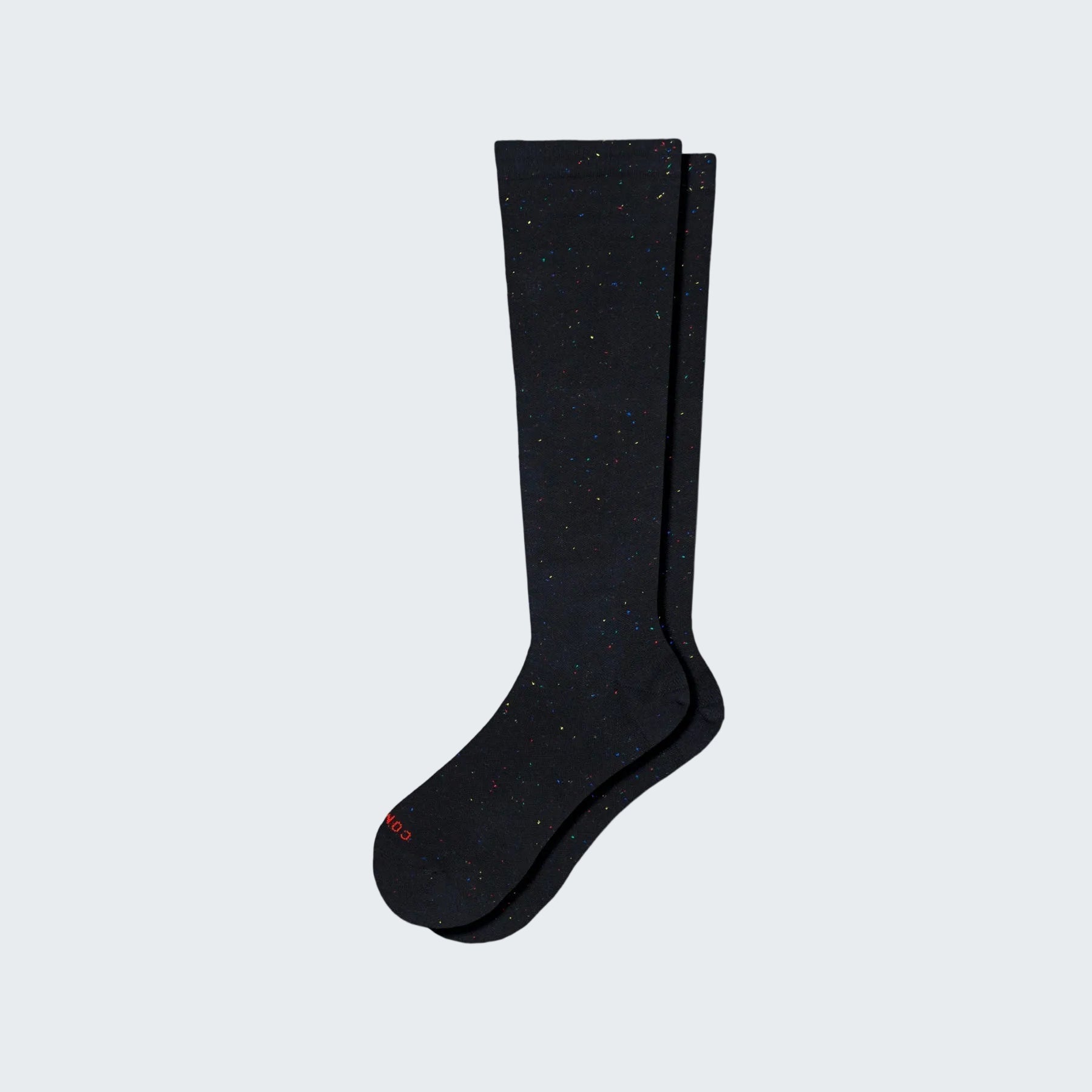 Pair of black knee-high socks on a white background