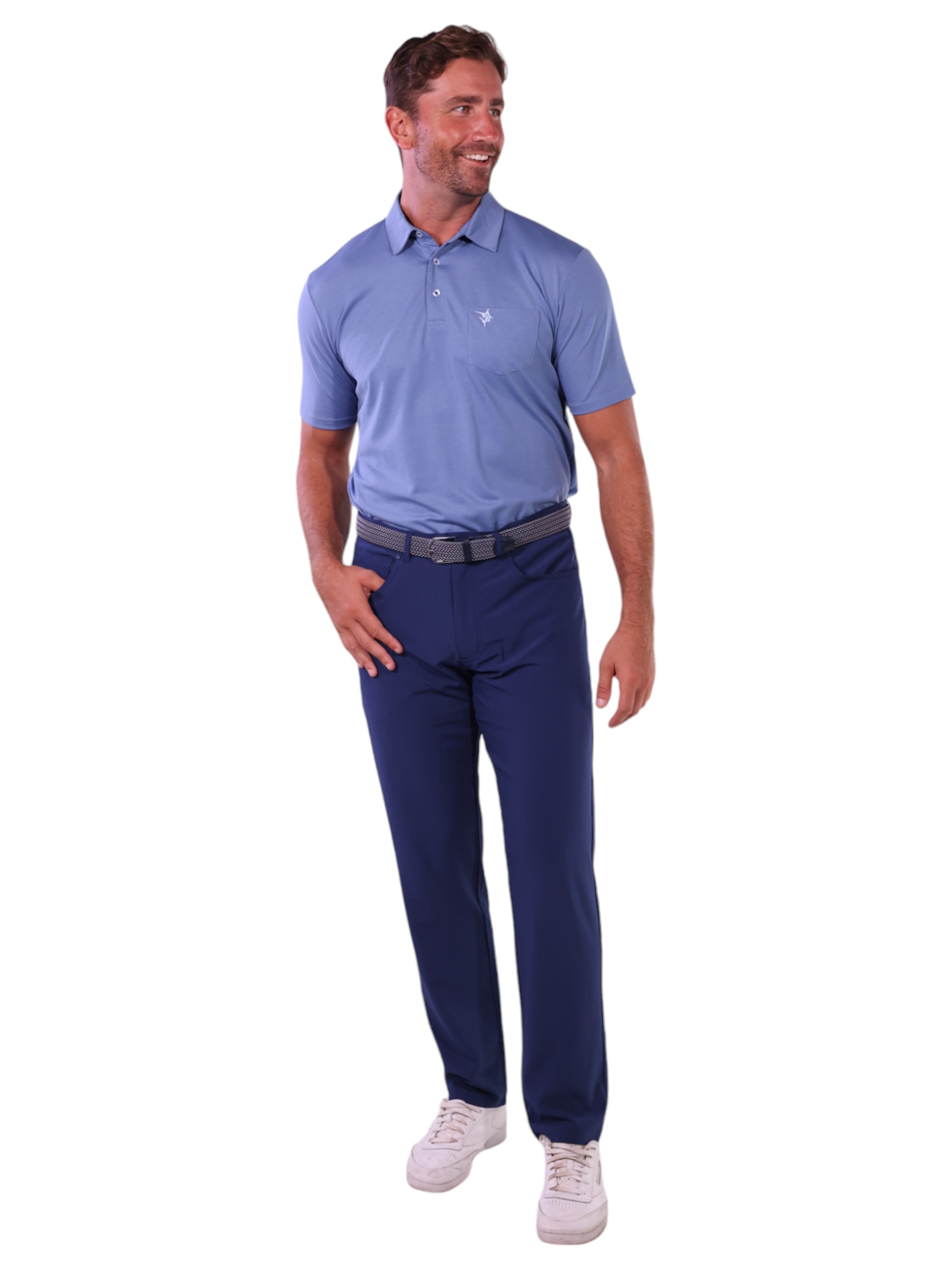 Man wearing a blue polo shirt and navy pants on a white background