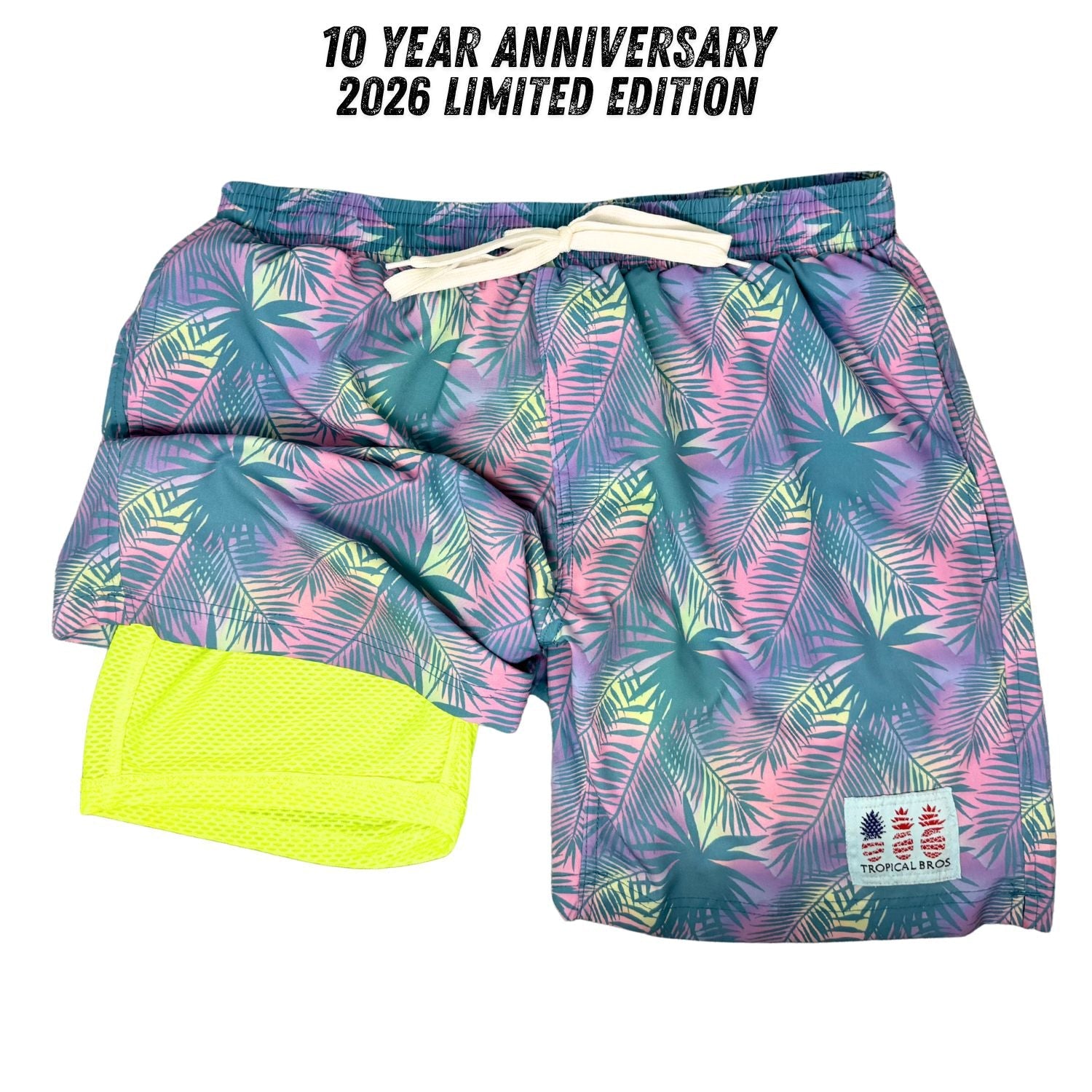 Tropical leaf patterned shorts with a 10 Year Anniversary 2026 Limited Edition label.