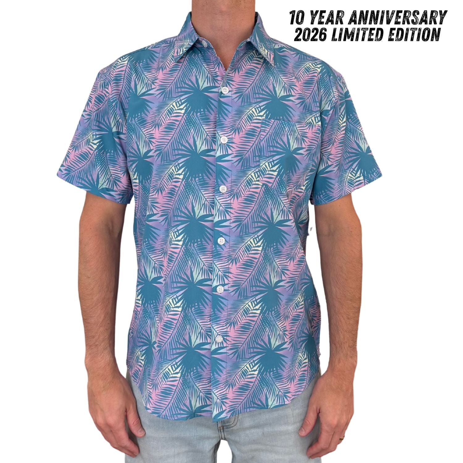 Person wearing a colorful patterned shirt with text indicating a 10-year anniversary and limited edition design.