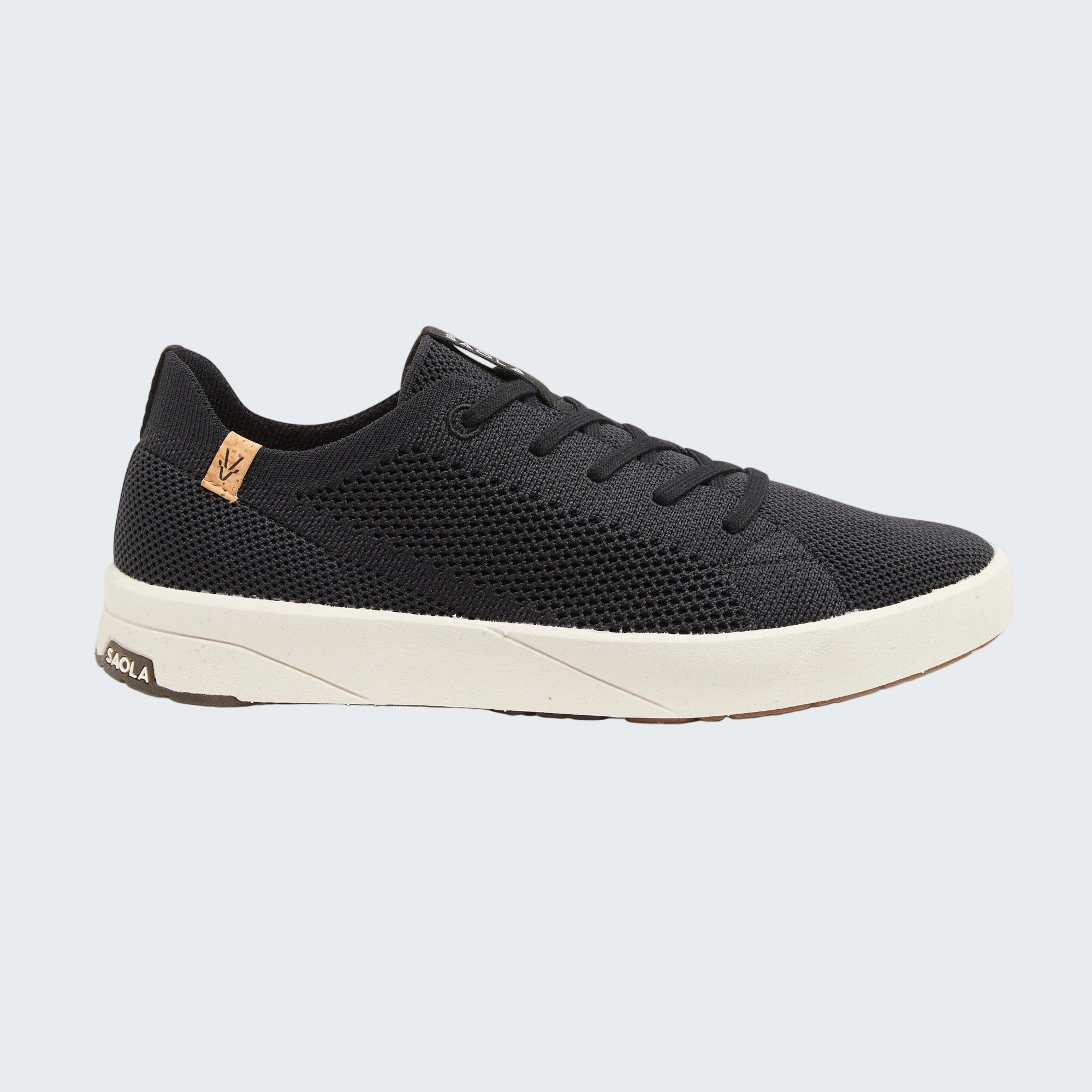 Navy blue sneaker with white sole on a white background