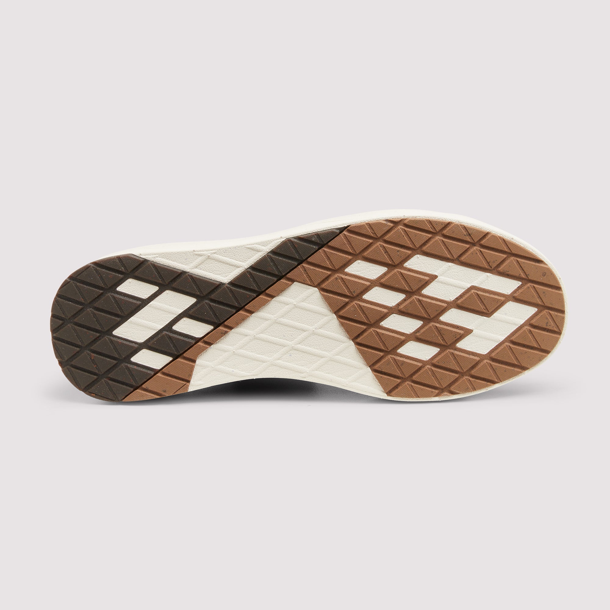 The outsole of a sneaker shown from a top-down view, featuring a geometric tread pattern in brown, dark brown, and off-white on a light gray background.