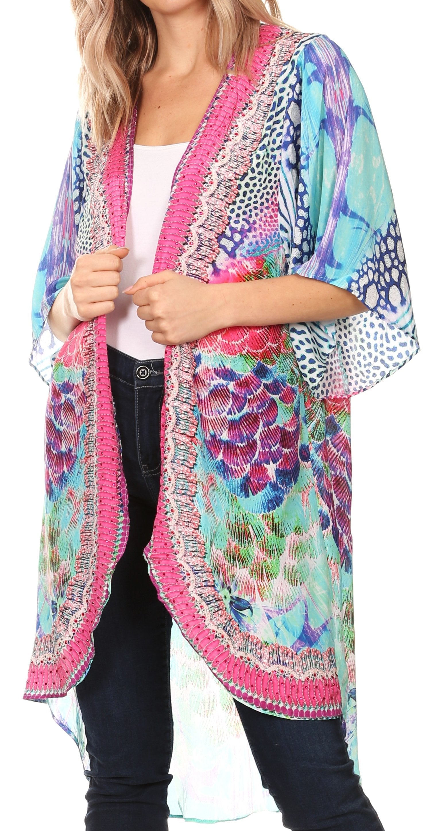 Woman wearing a colorful kimono-style jacket with floral patterns.