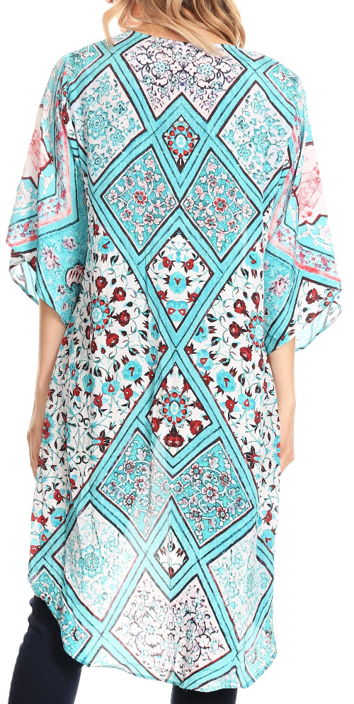 Woman wearing a colorful patterned dress with a geometric design.