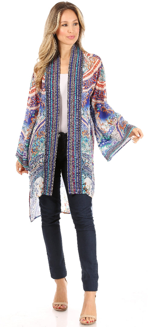 Woman wearing a colorful patterned kimono-style jacket on a white background