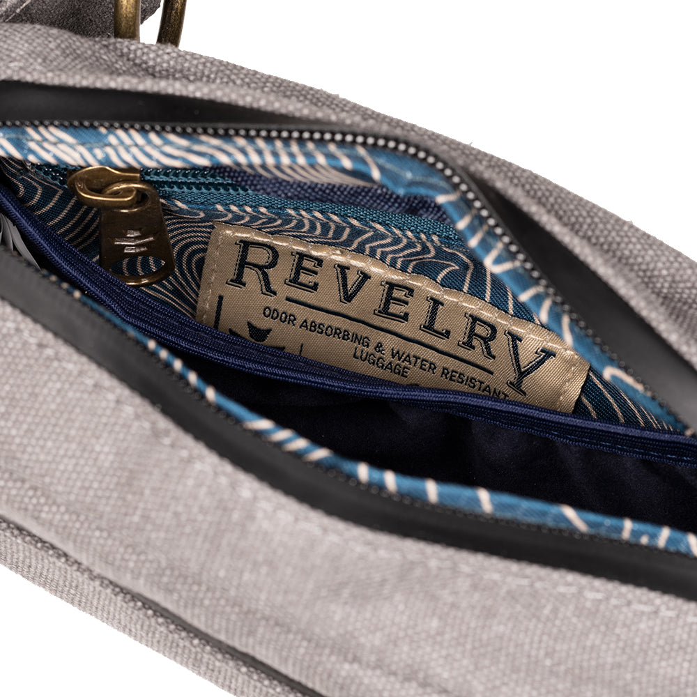 Gray bag with a visible 'Revelry' brand label on a white background