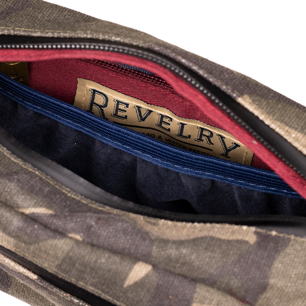 Open bag revealing a red interior with 'Revelry' branding.