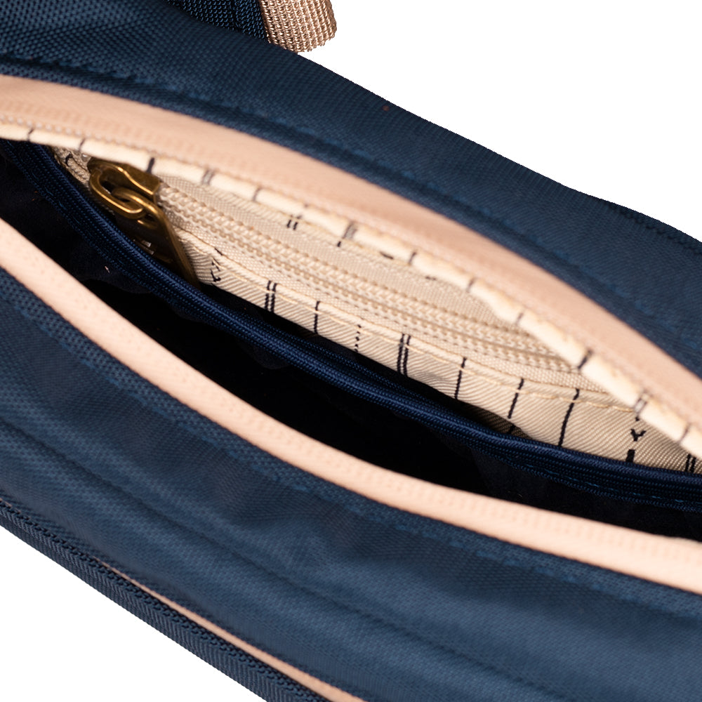 Close-up of a navy blue bag with beige interior lining