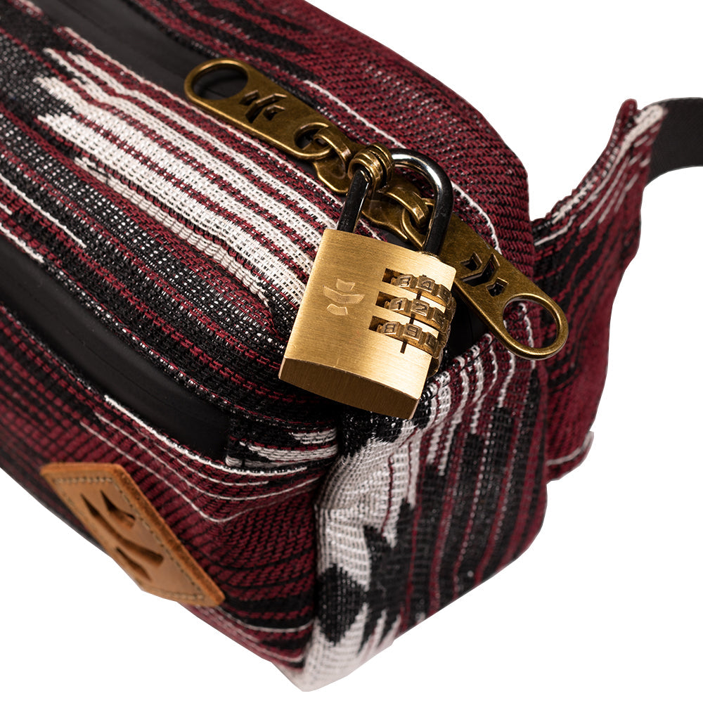 Patterned bag with a gold lock on a white background