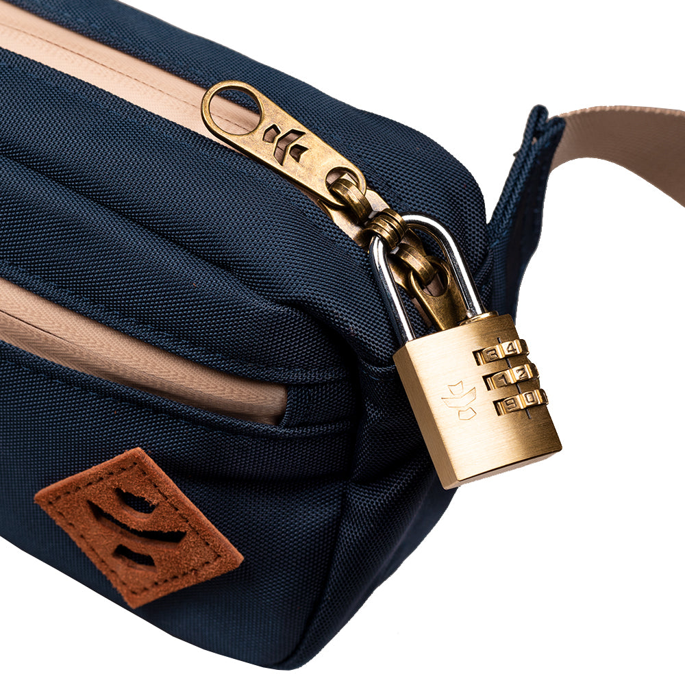 Navy blue bag with a gold combination lock on a white background