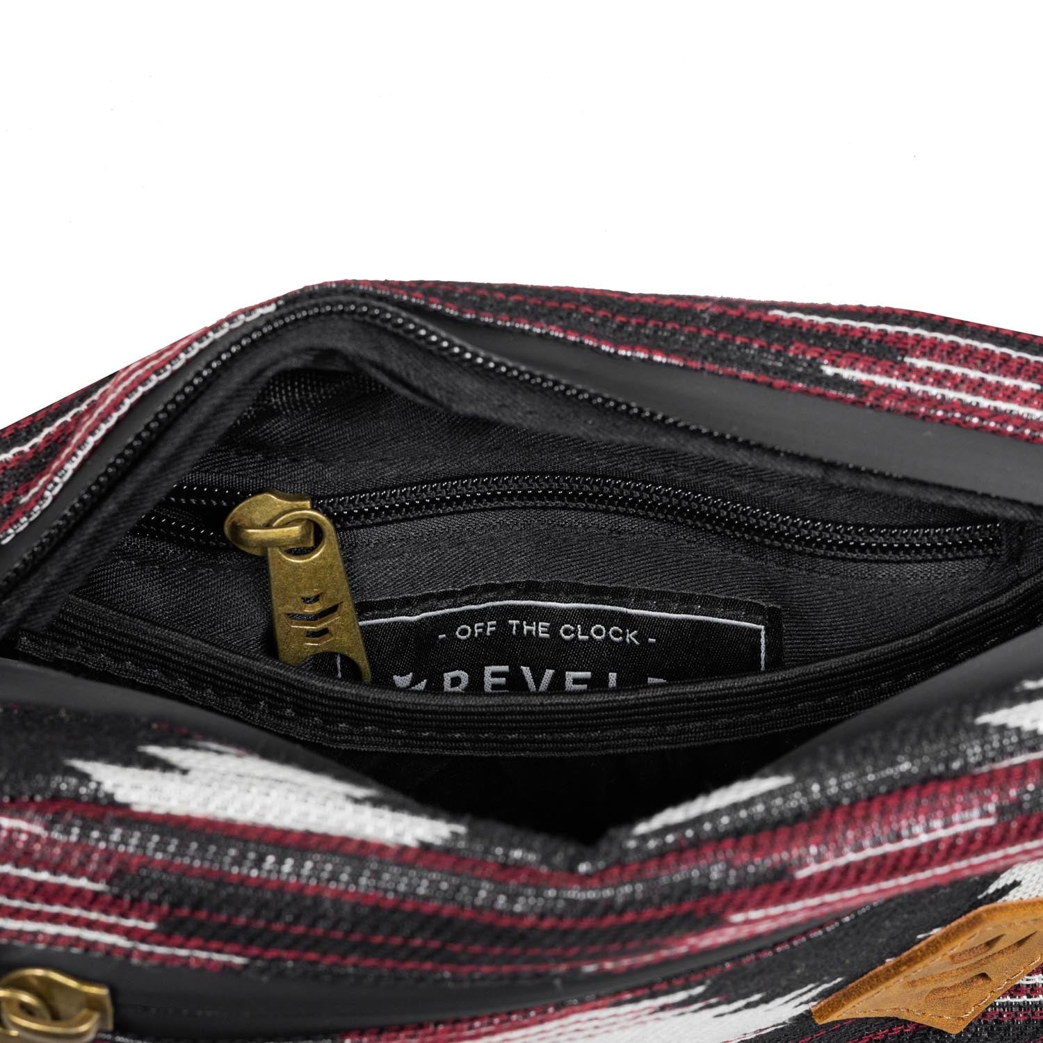 Close-up of a striped bag with a visible brand label on a white background