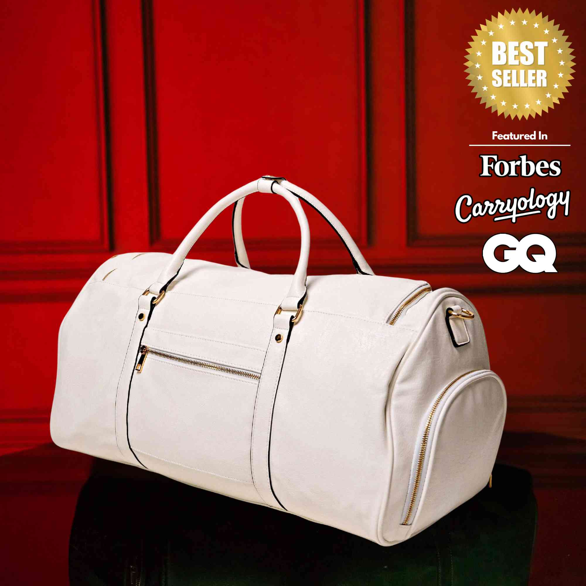 White duffel bag on a dark surface with a red background featuring 'Forbes', 'Carryology', and 'GQ' logos.