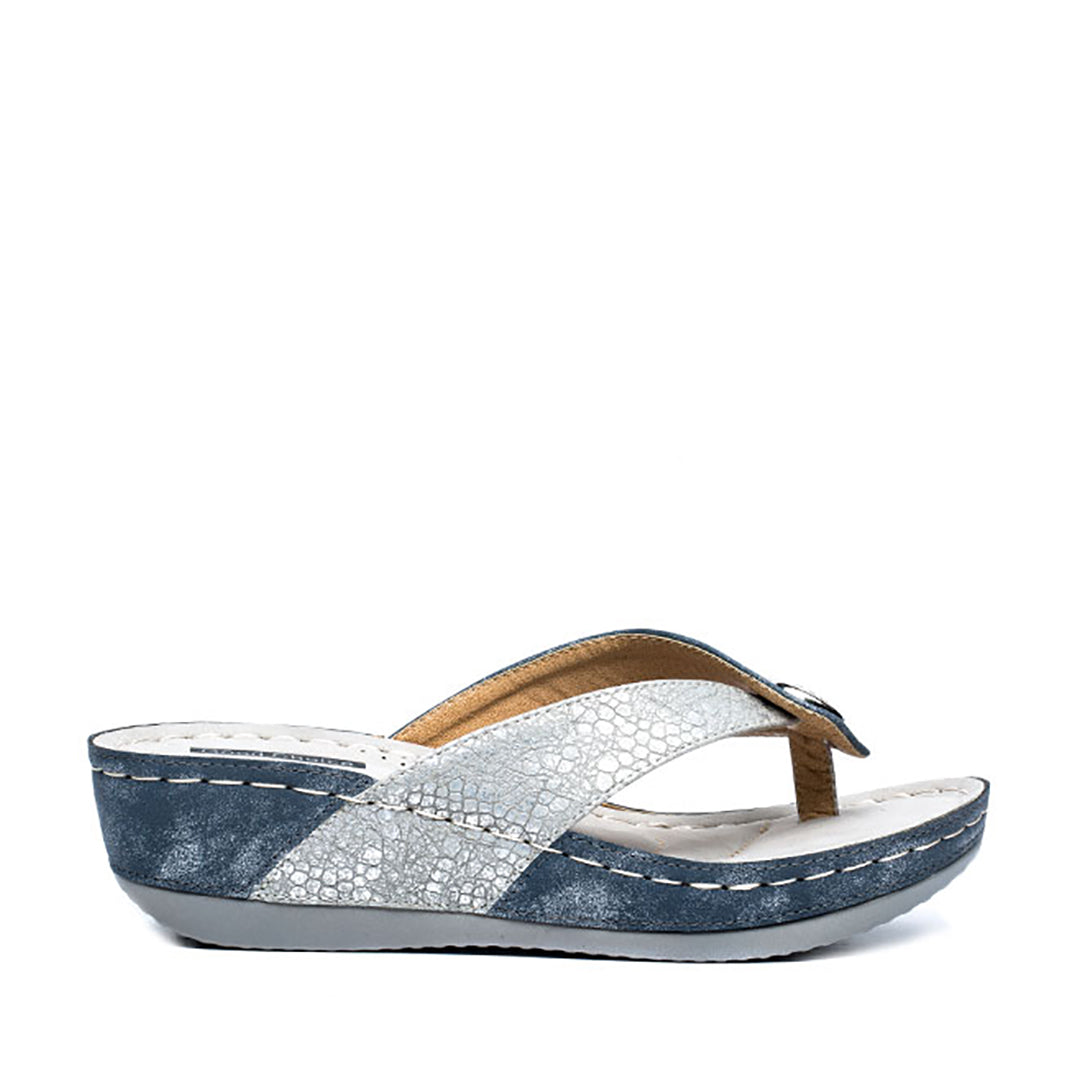 Blue and white sandal with a textured strap on a white background