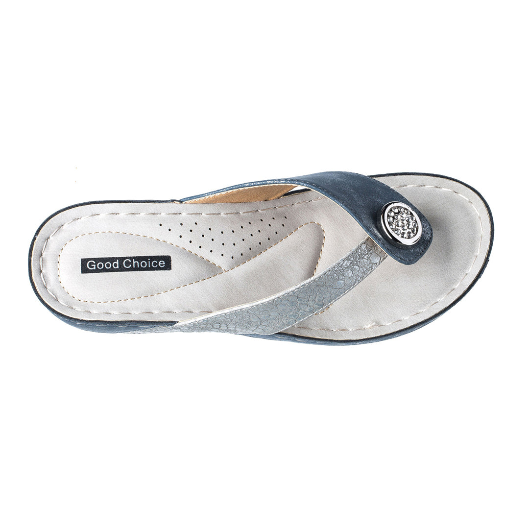 Blue sandal with a white sole on a white background