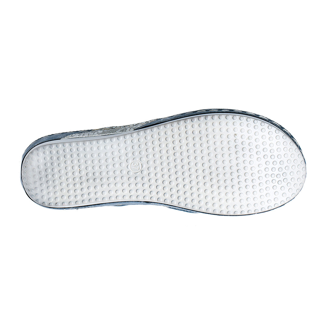 Close-up of a shoe sole with textured surface on a white background