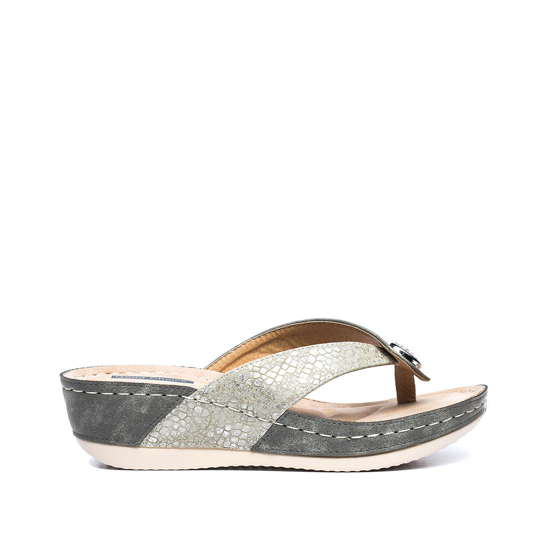 Gray wedge sandal with a unique pattern on a white background