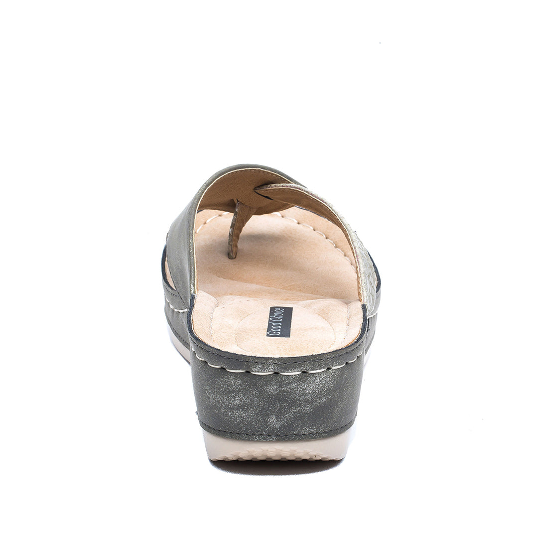 Gray slip-on shoe with white sole on a white background