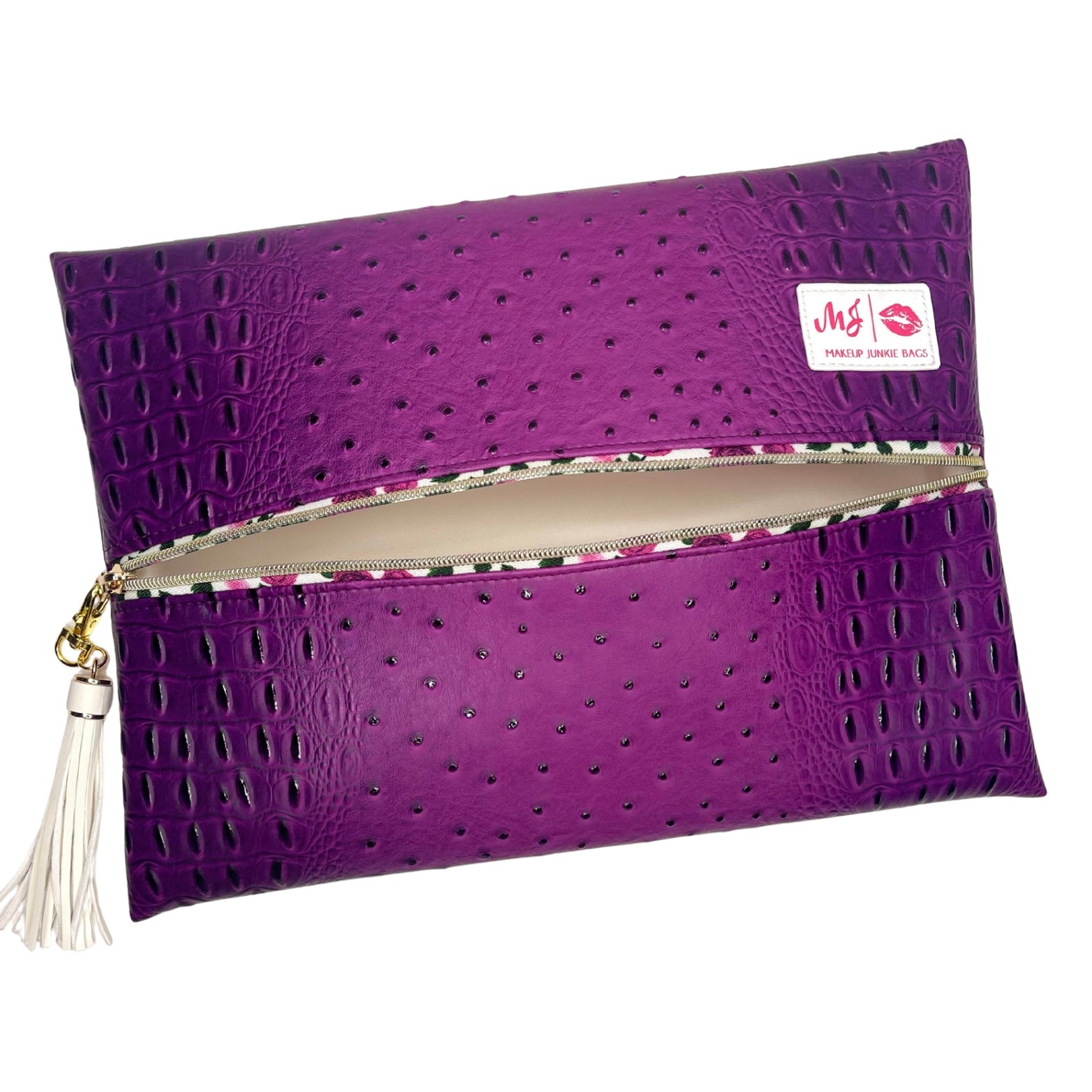 Purple clutch bag with textured surface and visible brand logo on a white background