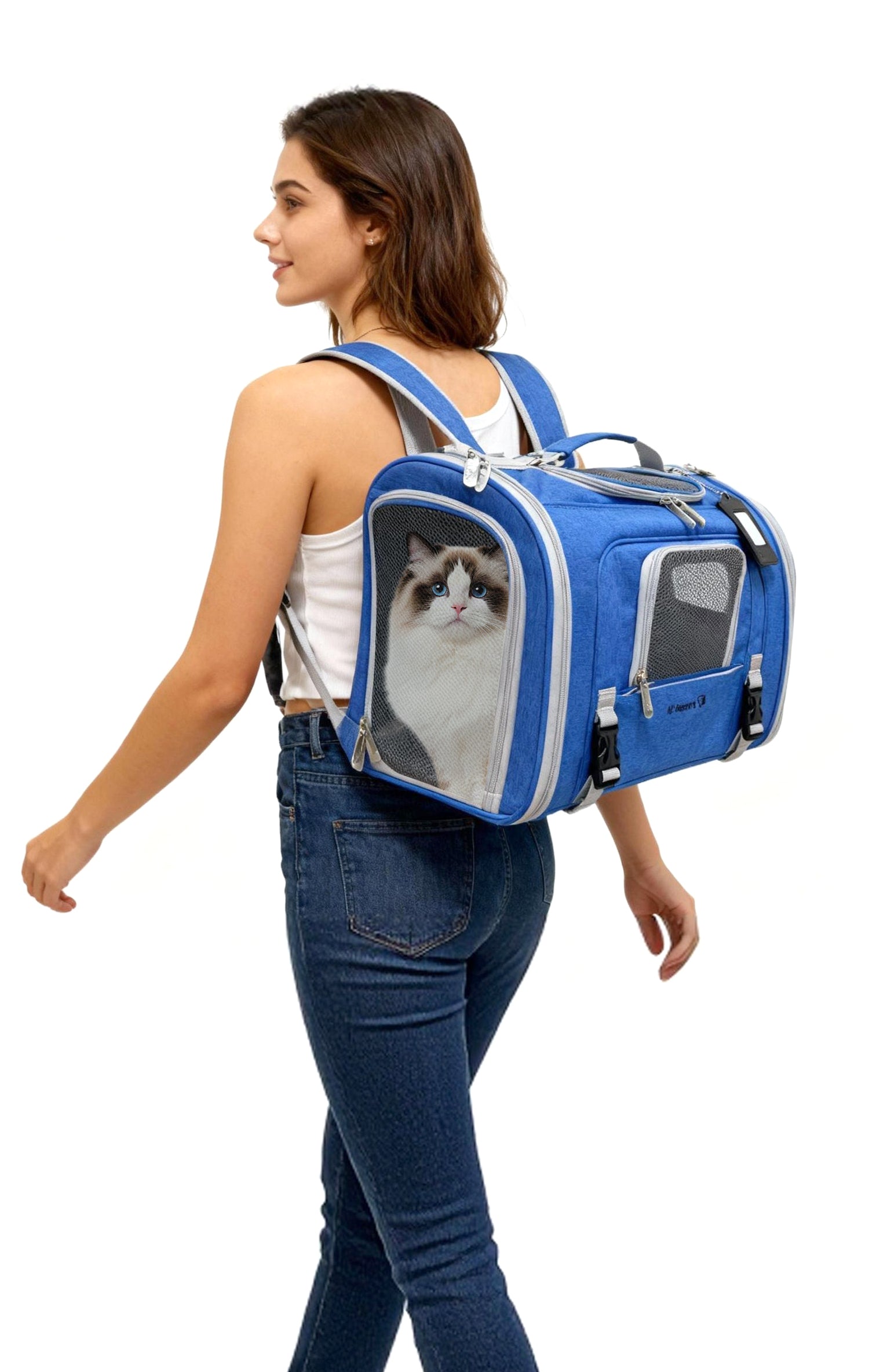 Woman carrying a blue pet carrier with a cat inside on a white background