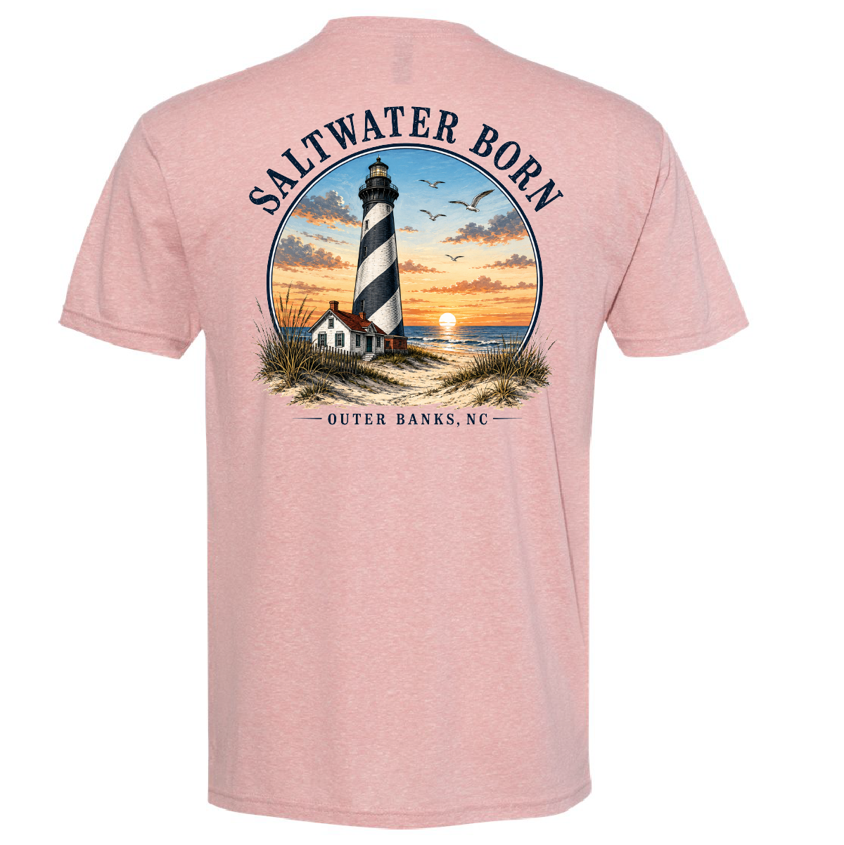 A heather pink short-sleeve t-shirt shown from the back, featuring a large circular graphic of a lighthouse at sunset with the text 'SALTWATER BORN' and 'OUTER BANKS, NC'.