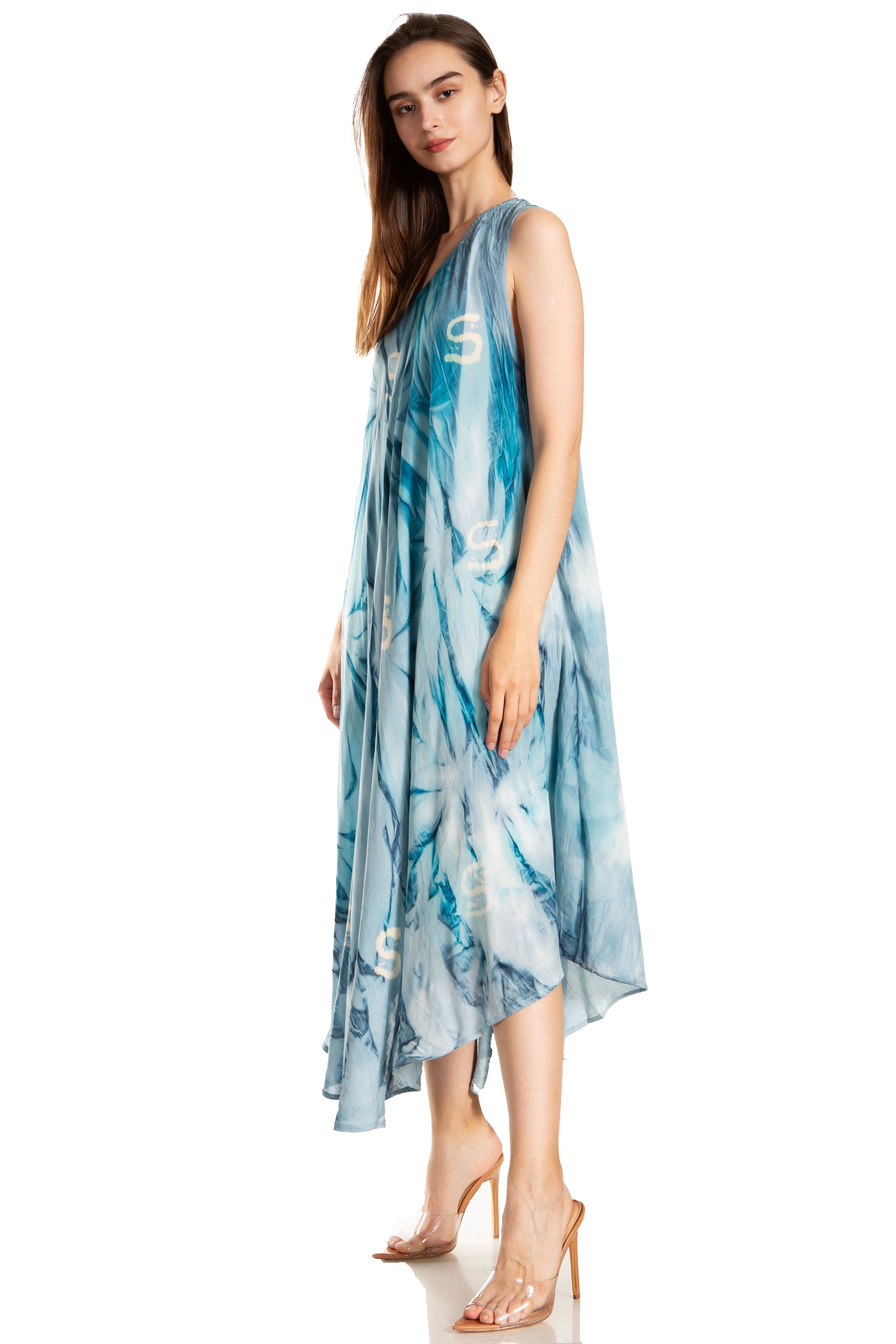 Woman wearing a blue tie-dye dress on a white background