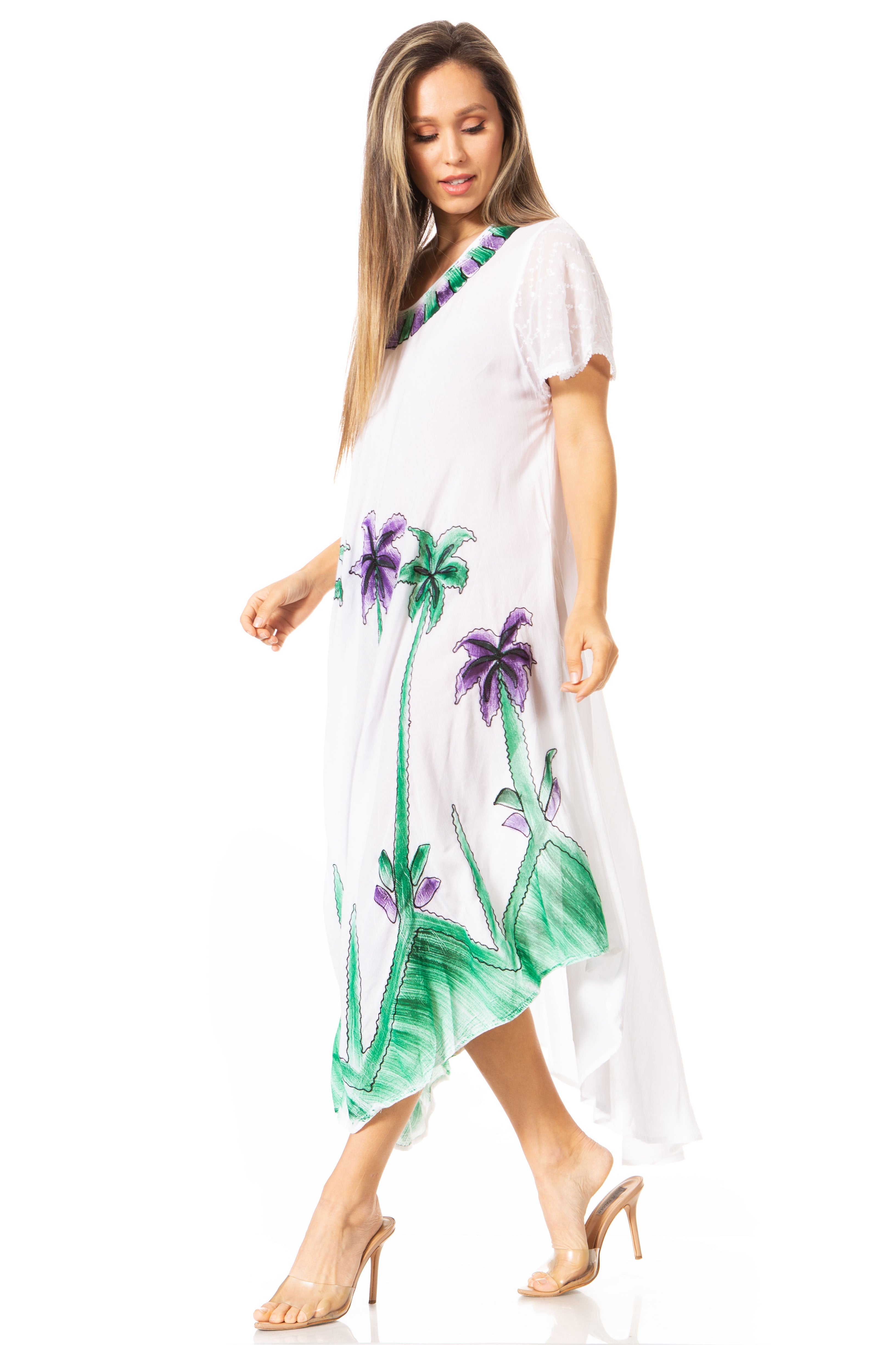Woman wearing a white dress with tropical palm tree design on a white background