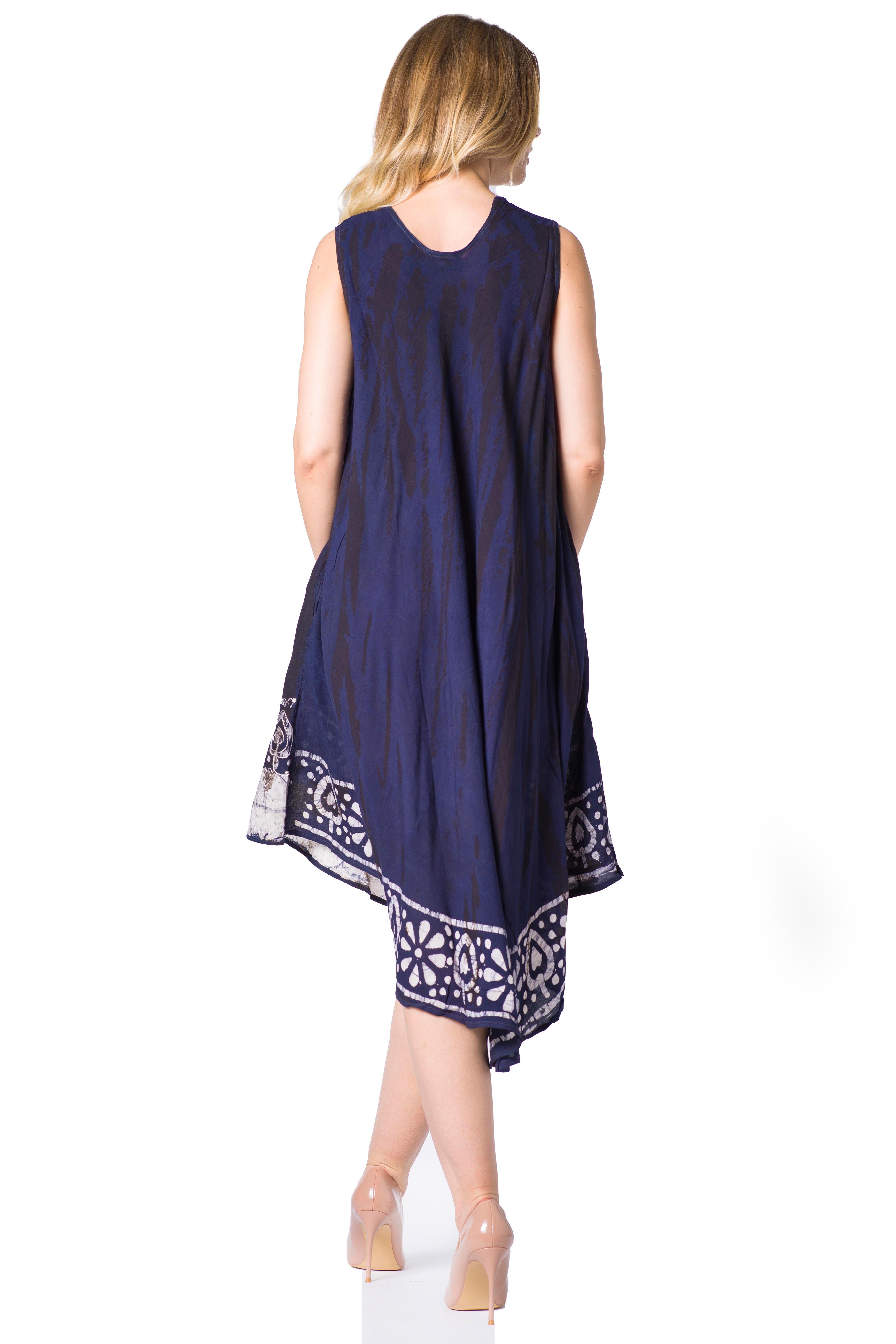 Woman wearing a sleeveless navy dress with white patterns on a white background