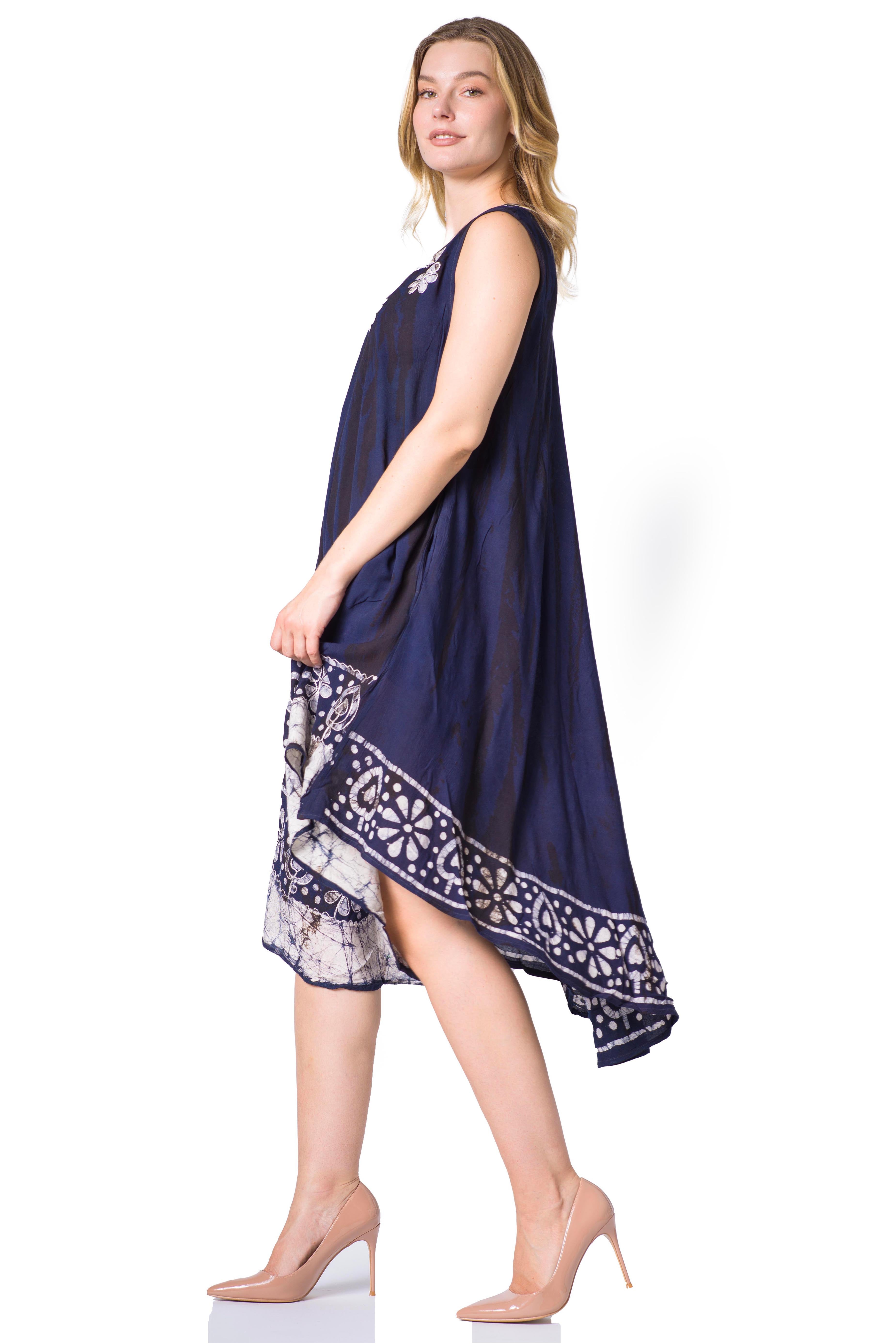 Woman wearing a navy blue dress with white lace details on a white background