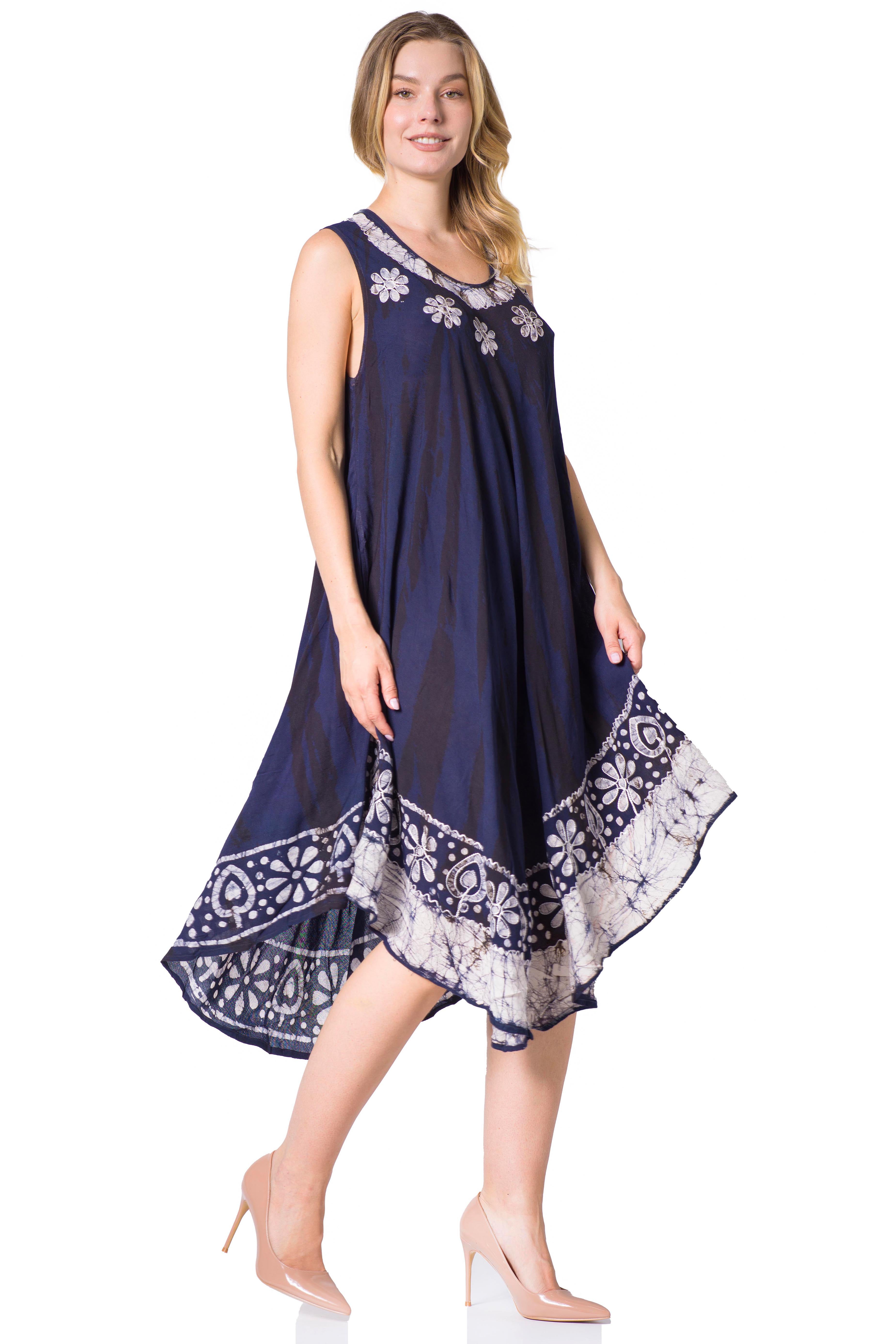 Woman wearing a navy blue dress with white floral patterns on a white background