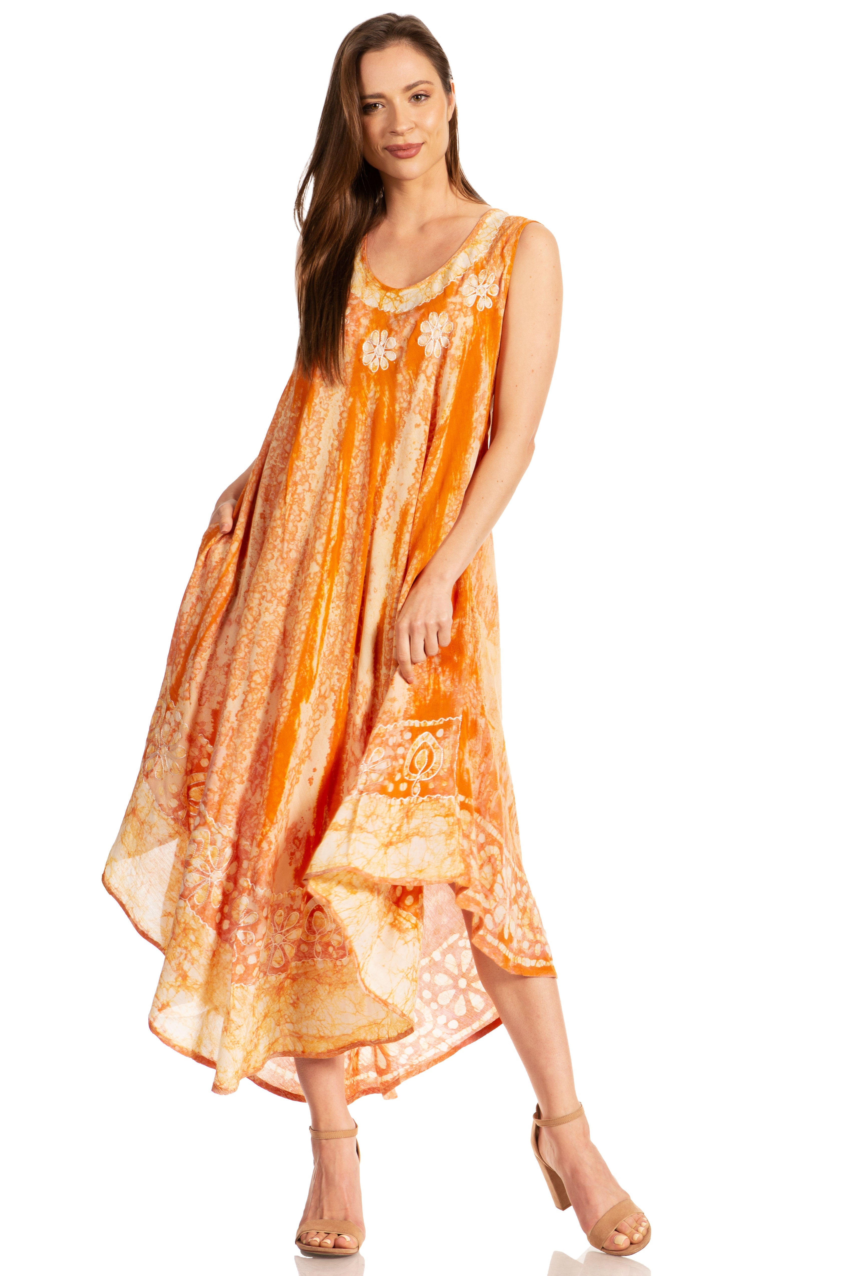Woman wearing an orange floral dress on a white background