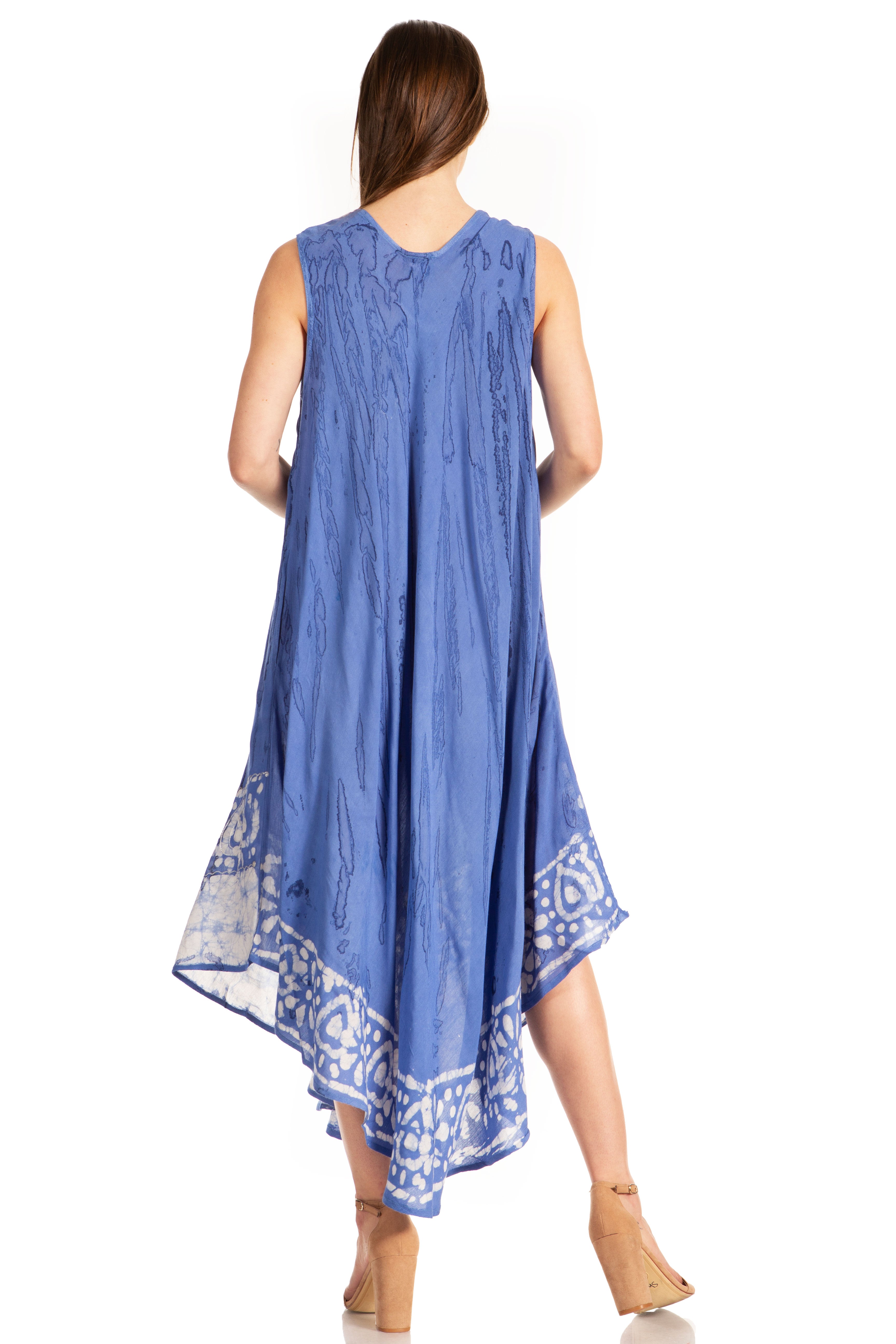 Woman wearing a blue sleeveless dress with white patterns on a white background
