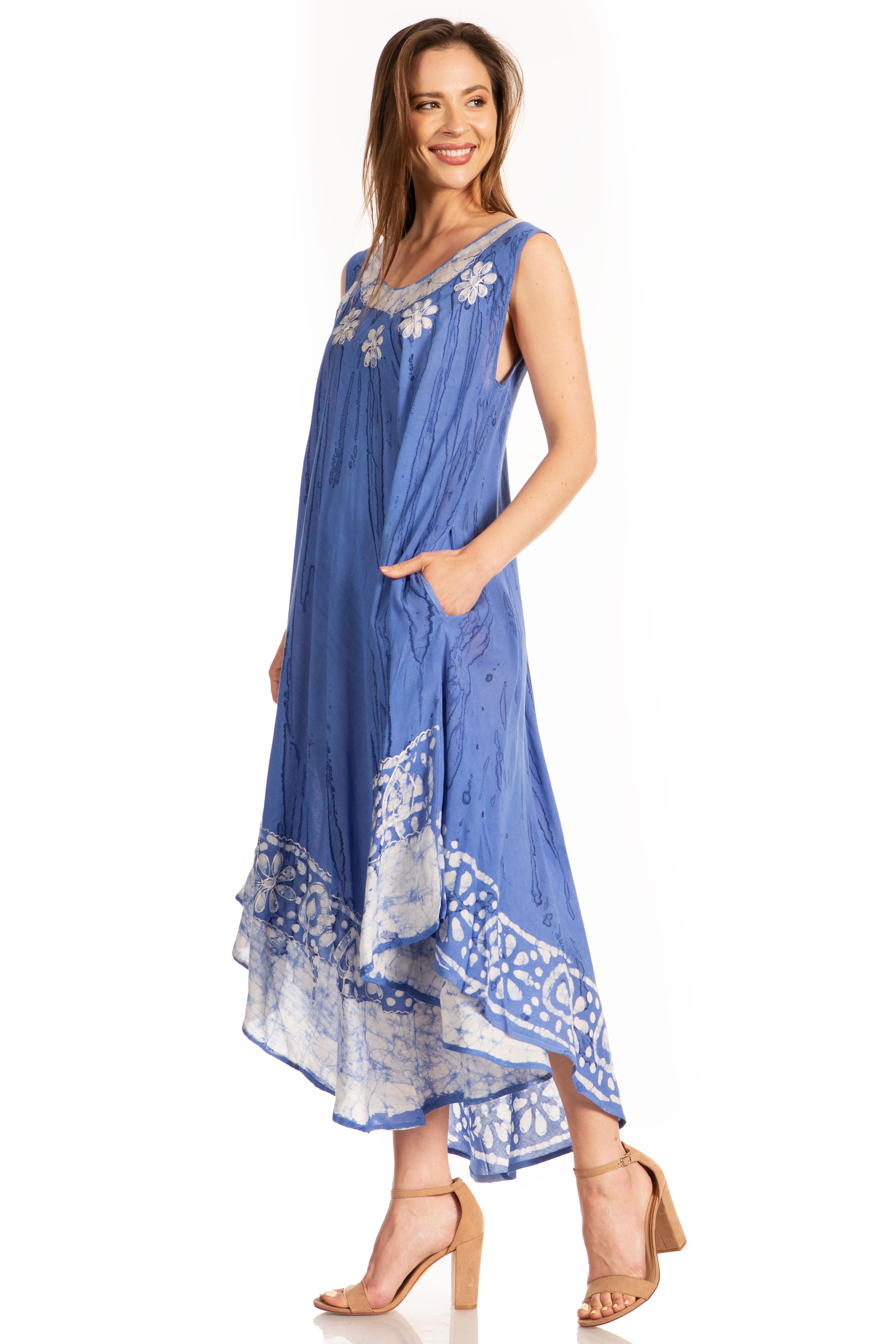 Woman wearing a blue dress with floral patterns on a white background