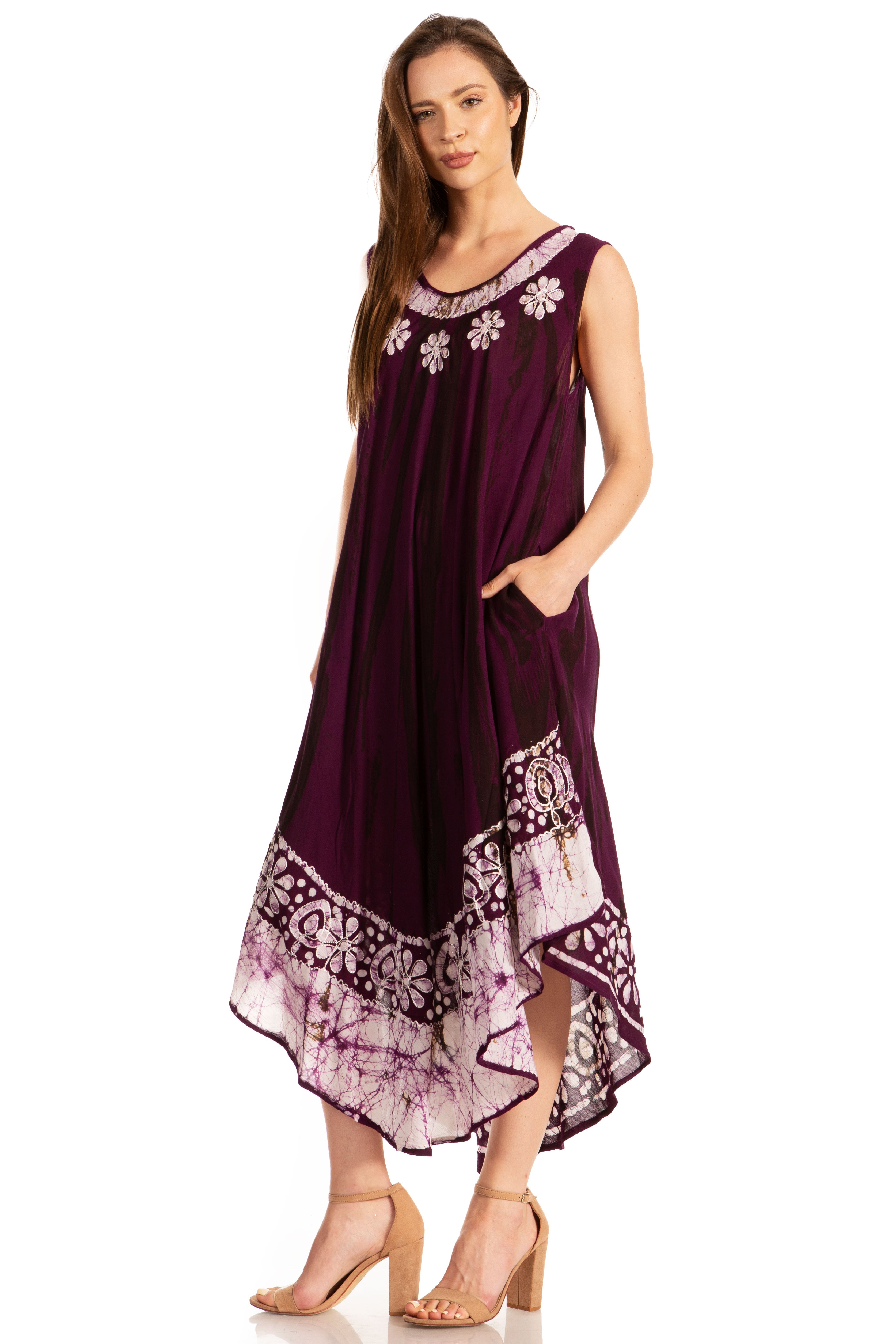 Woman wearing a purple dress with floral patterns on a white background