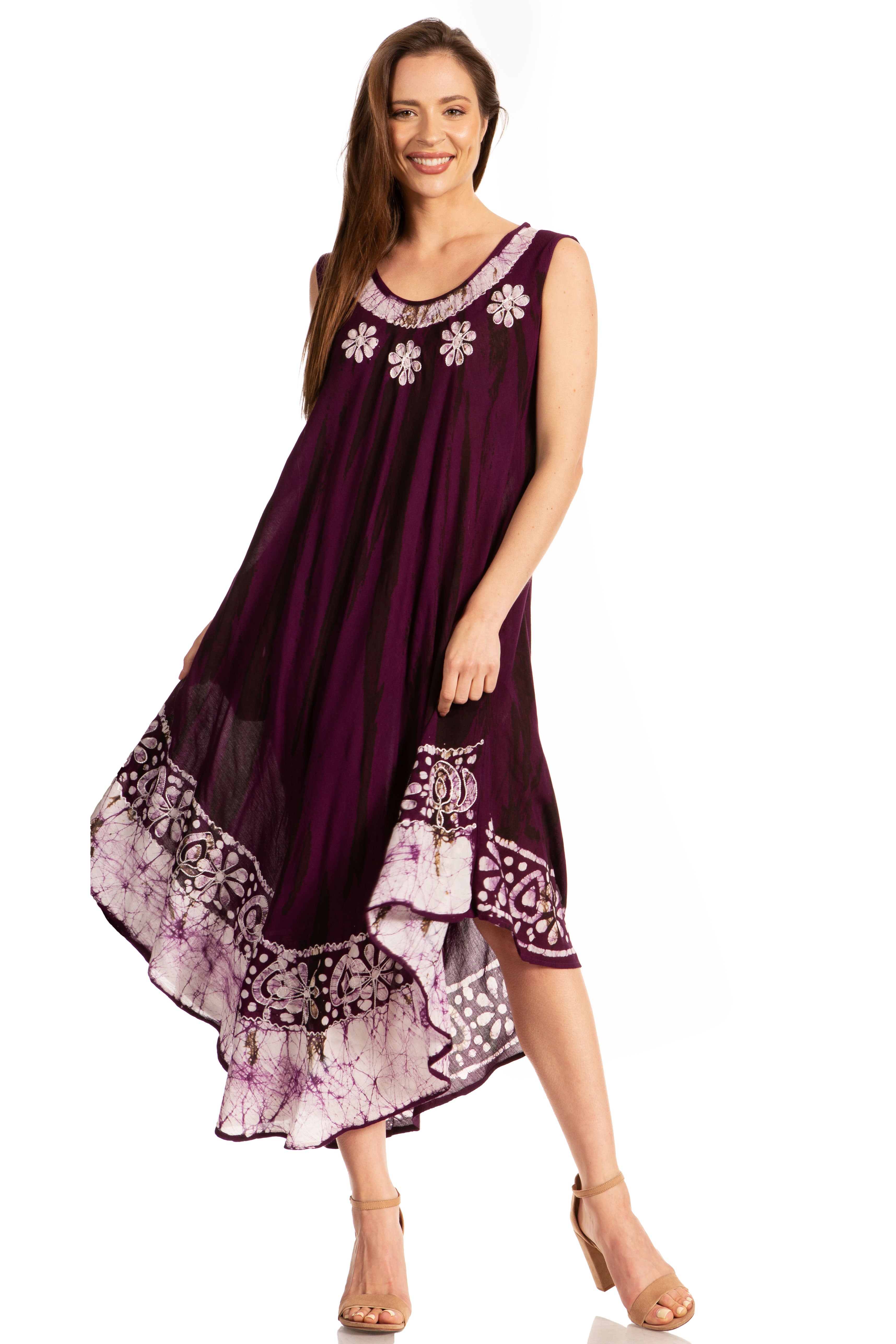 Woman wearing a purple dress with floral patterns on a white background