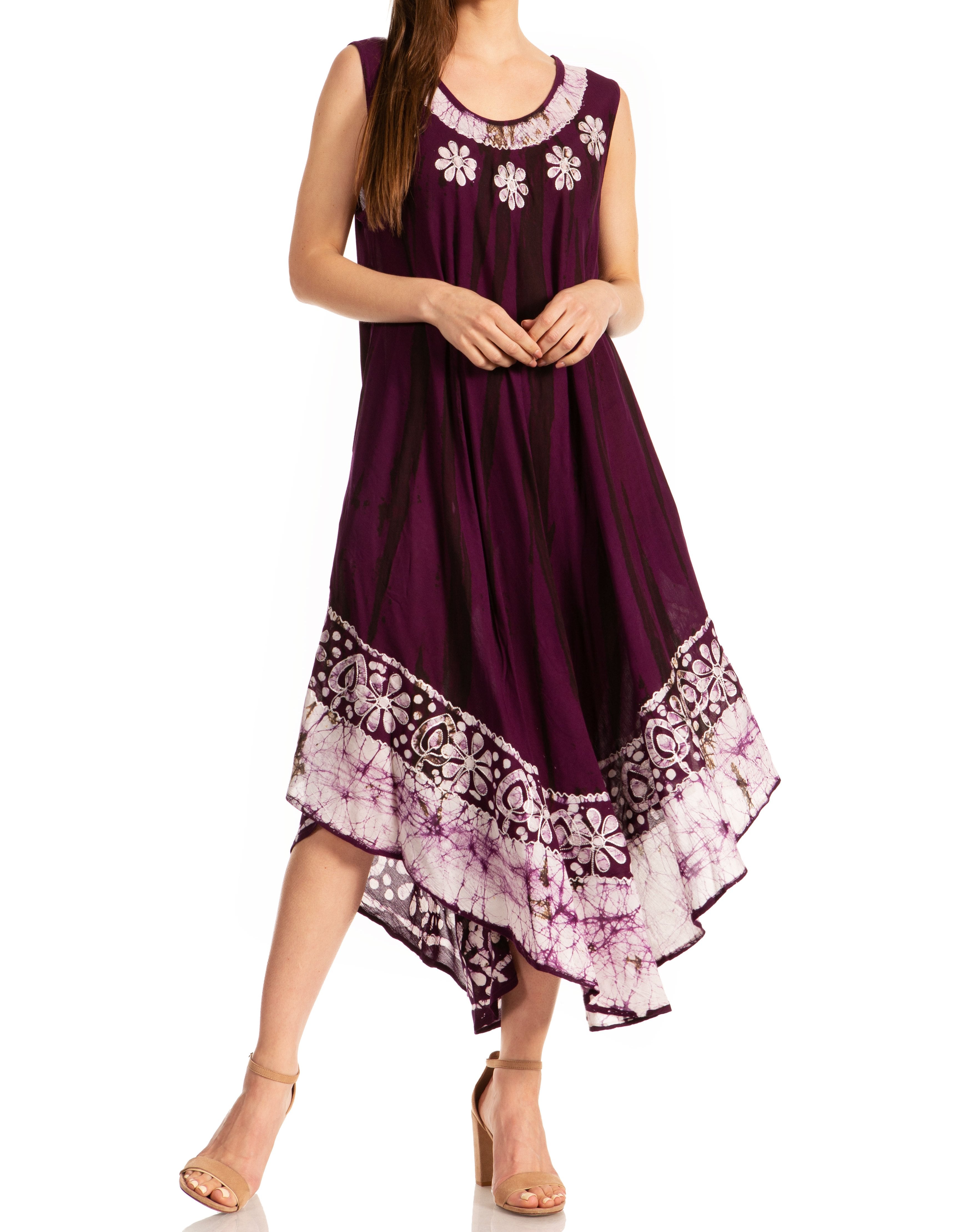 Woman wearing a purple dress with floral patterns on a white background
