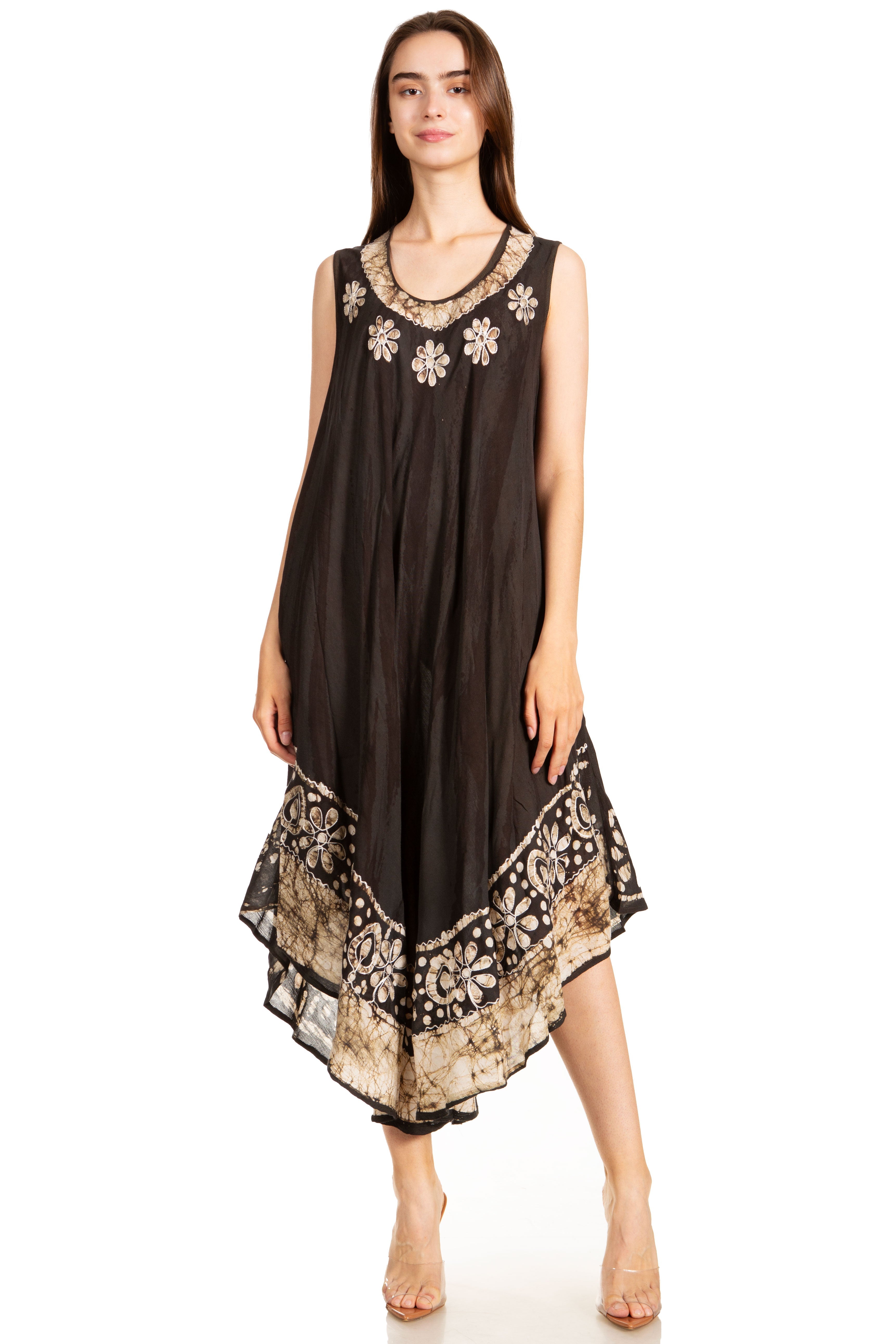 Woman wearing a black dress with floral embroidery on a white background