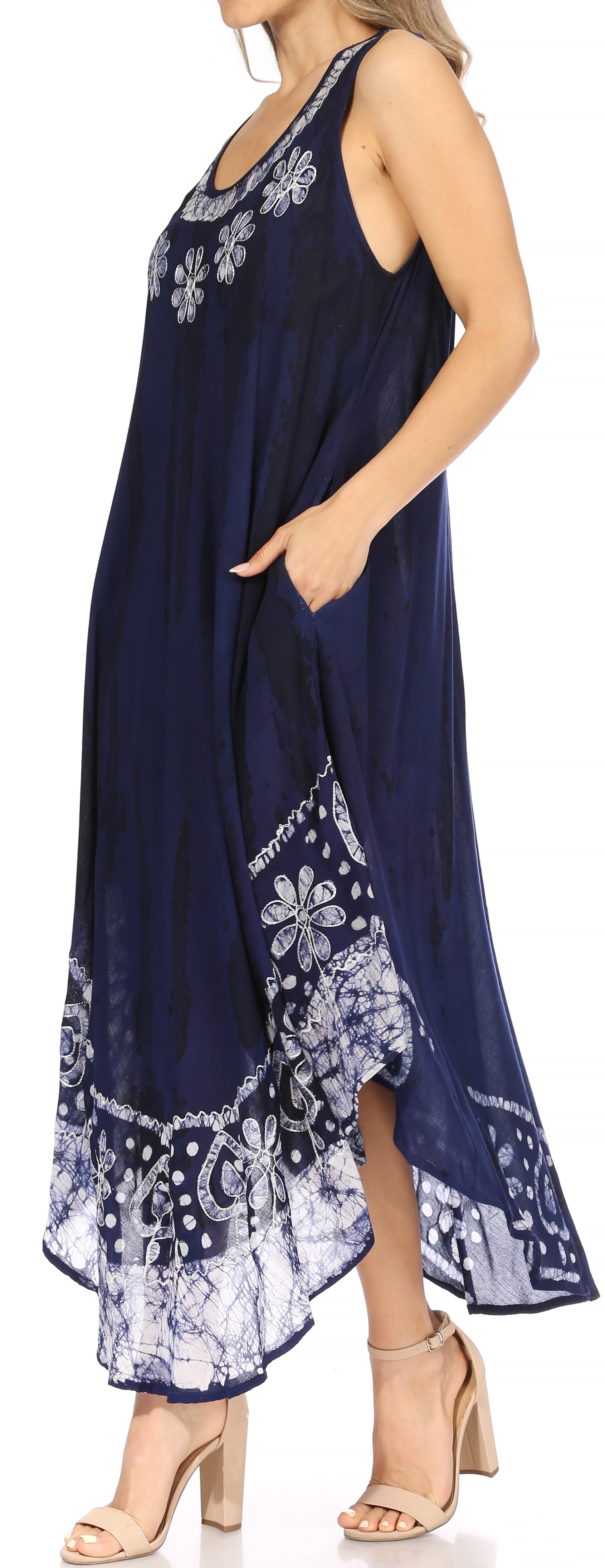 Navy blue dress with white floral patterns and embroidery on a white background