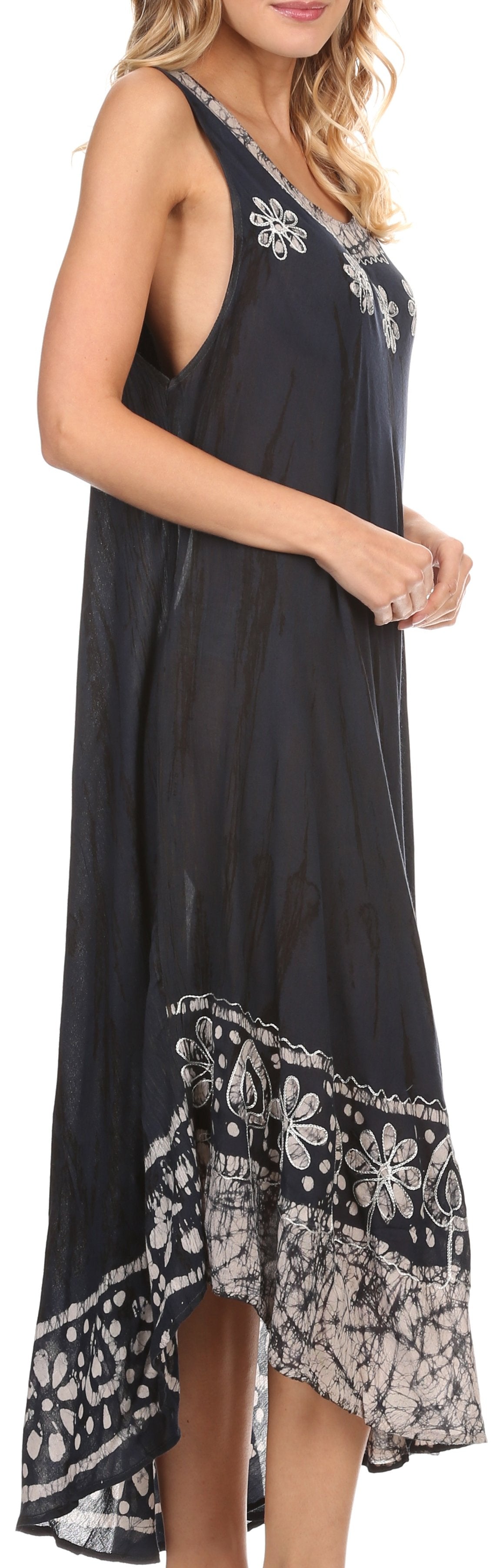 Woman wearing a black sleeveless dress with floral patterns