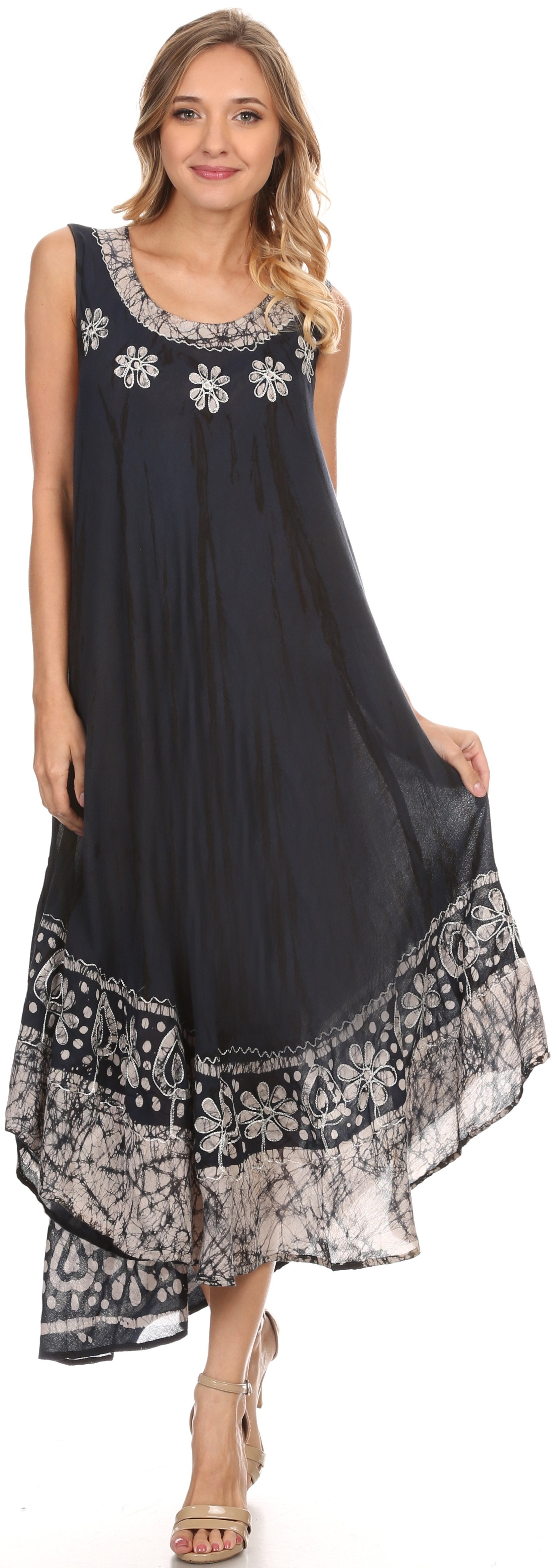 Woman wearing a black dress with floral patterns on a white background