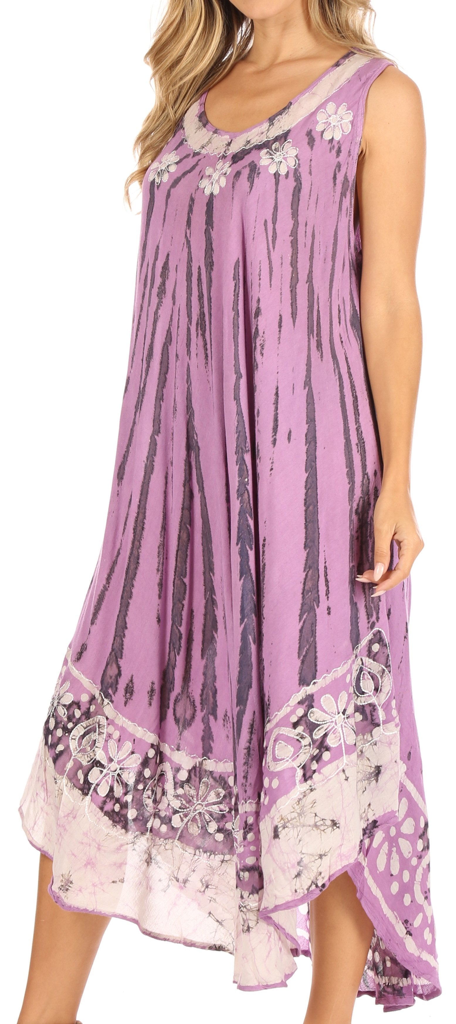 Woman wearing a purple floral dress with a white background