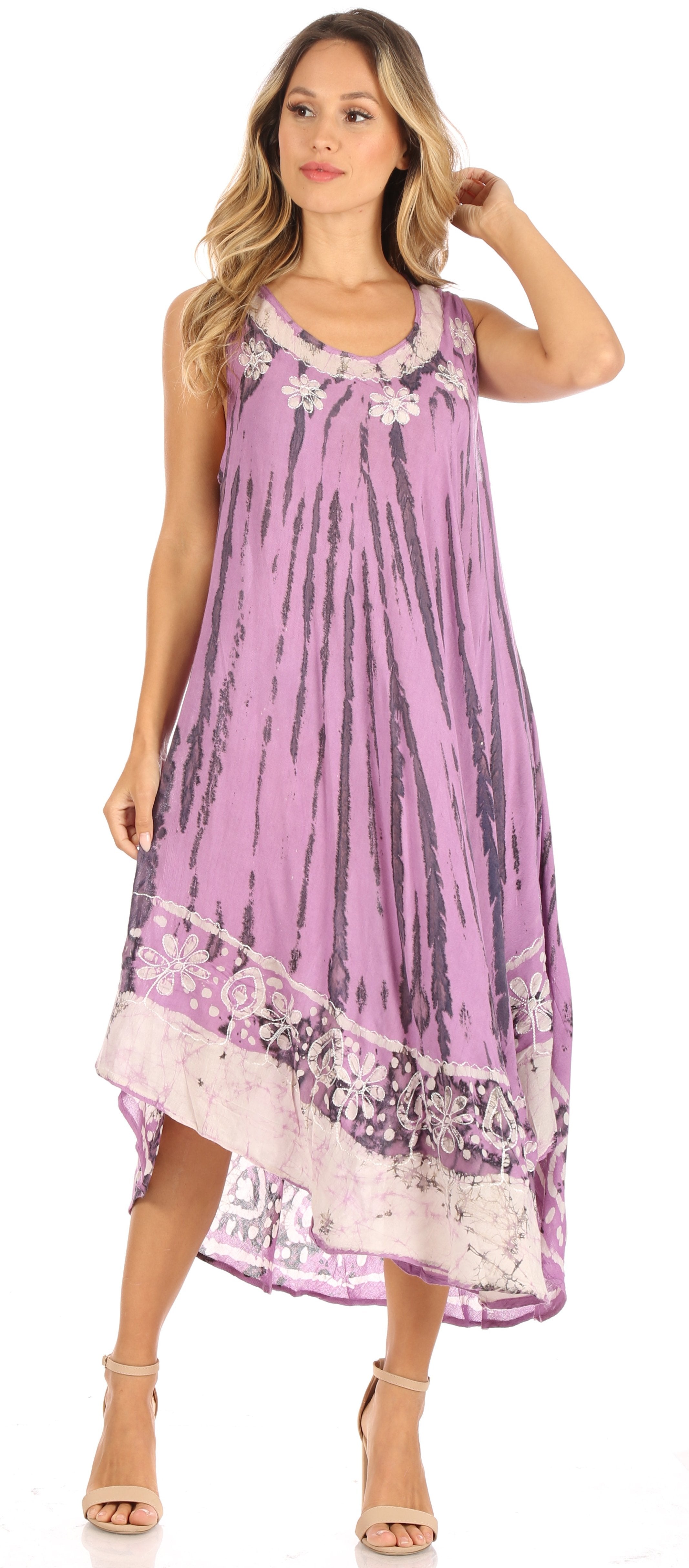 Woman wearing a purple dress with floral patterns on a white background