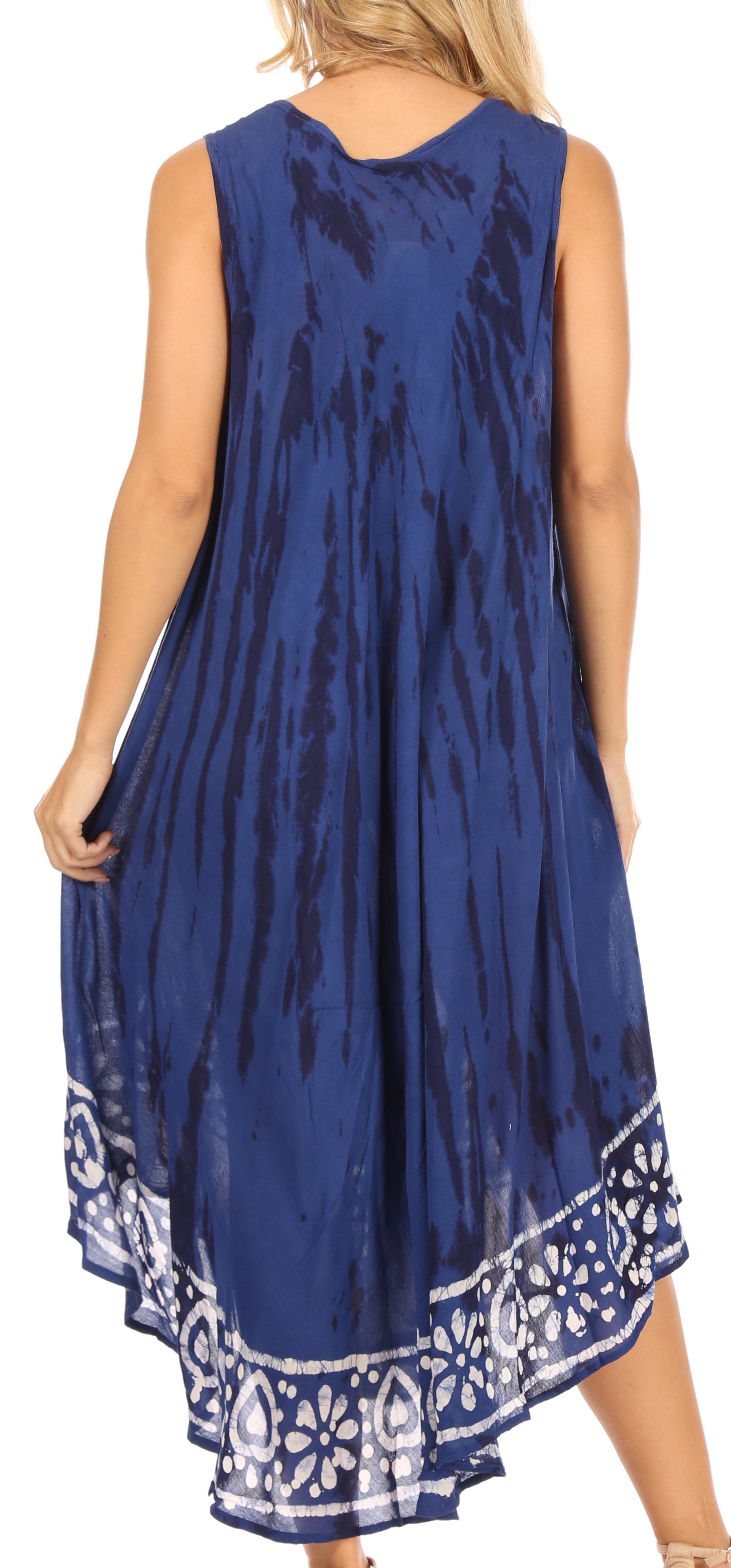 Woman wearing a blue sleeveless dress with a patterned hem on a white background