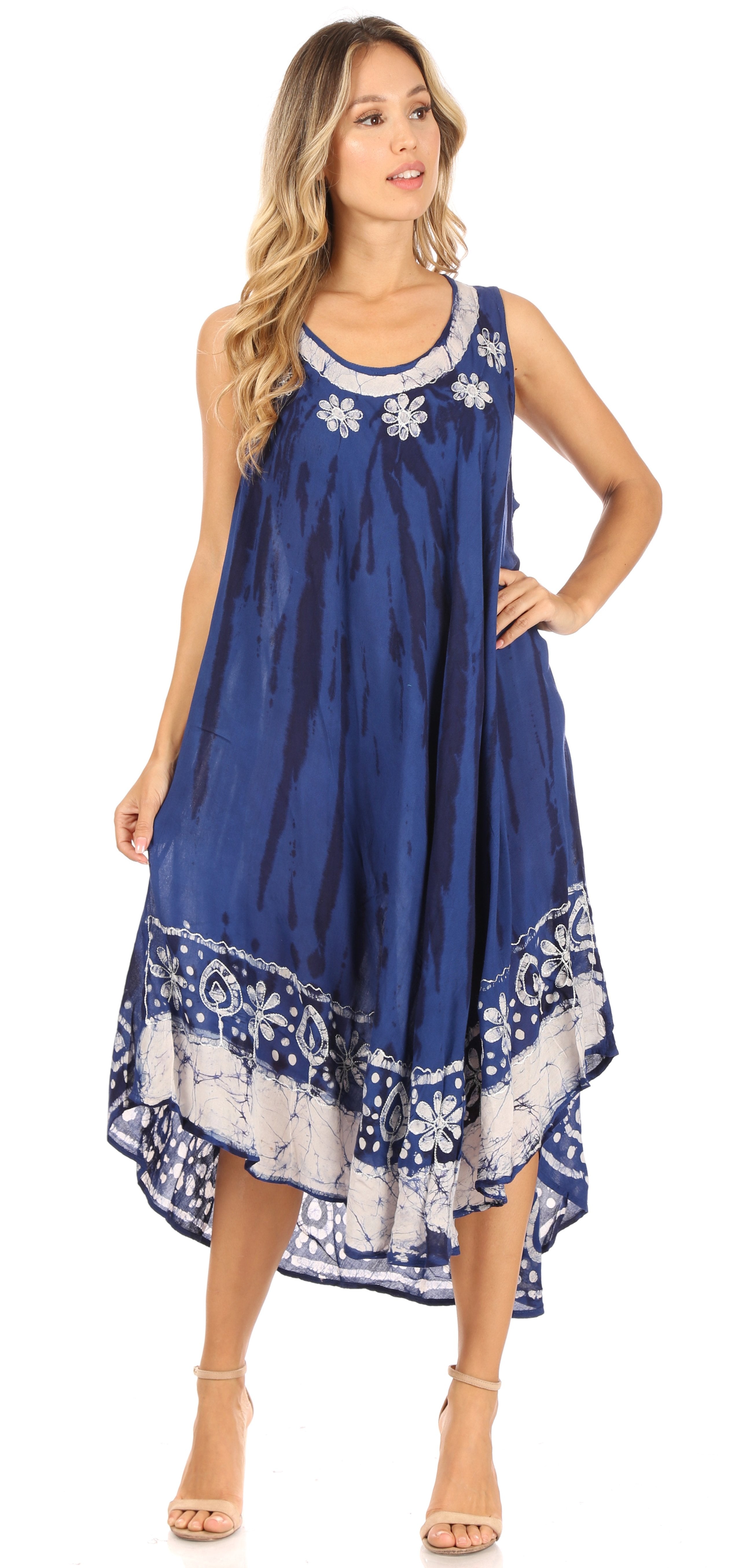Woman wearing a blue dress with white floral patterns on a white background