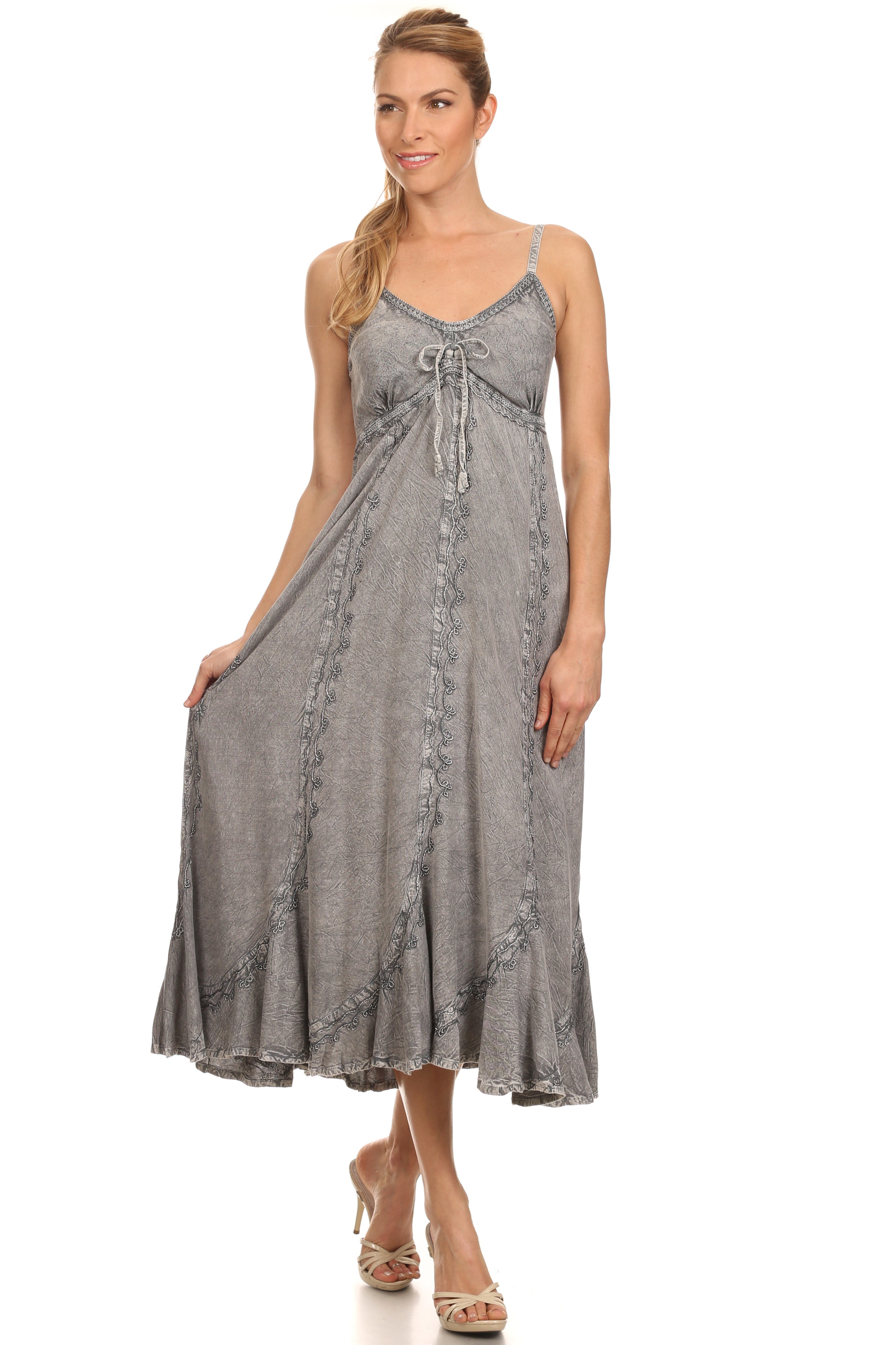 Woman wearing a gray sleeveless dress on a white background