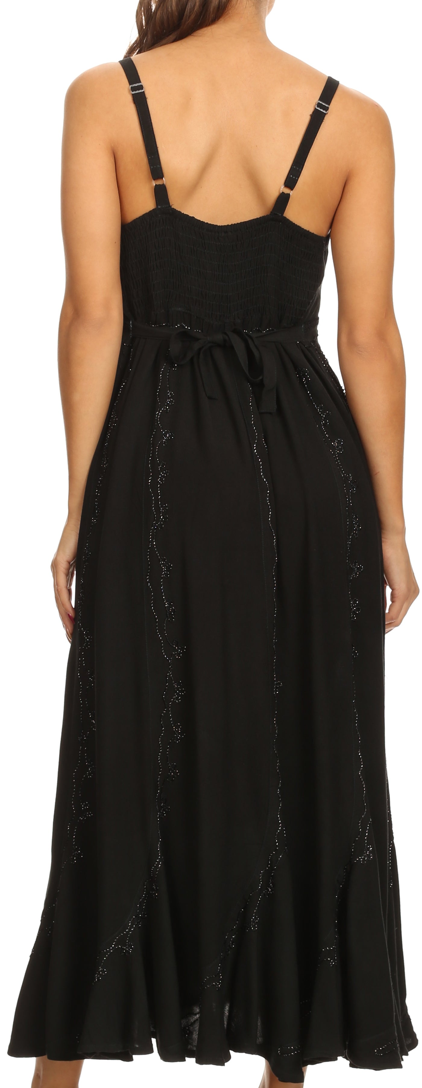 Black dress with thin straps and subtle pattern on a plain background