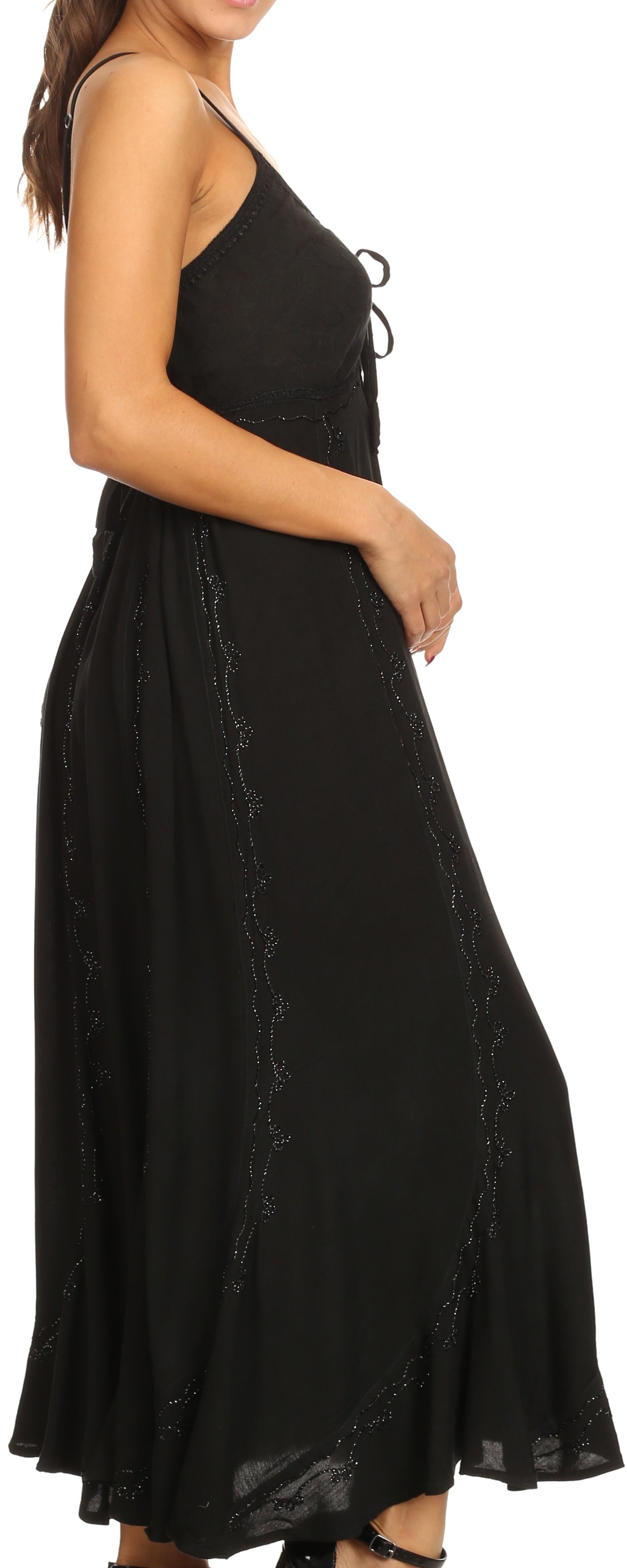 Black dress with thin straps and a flowing skirt on a white background