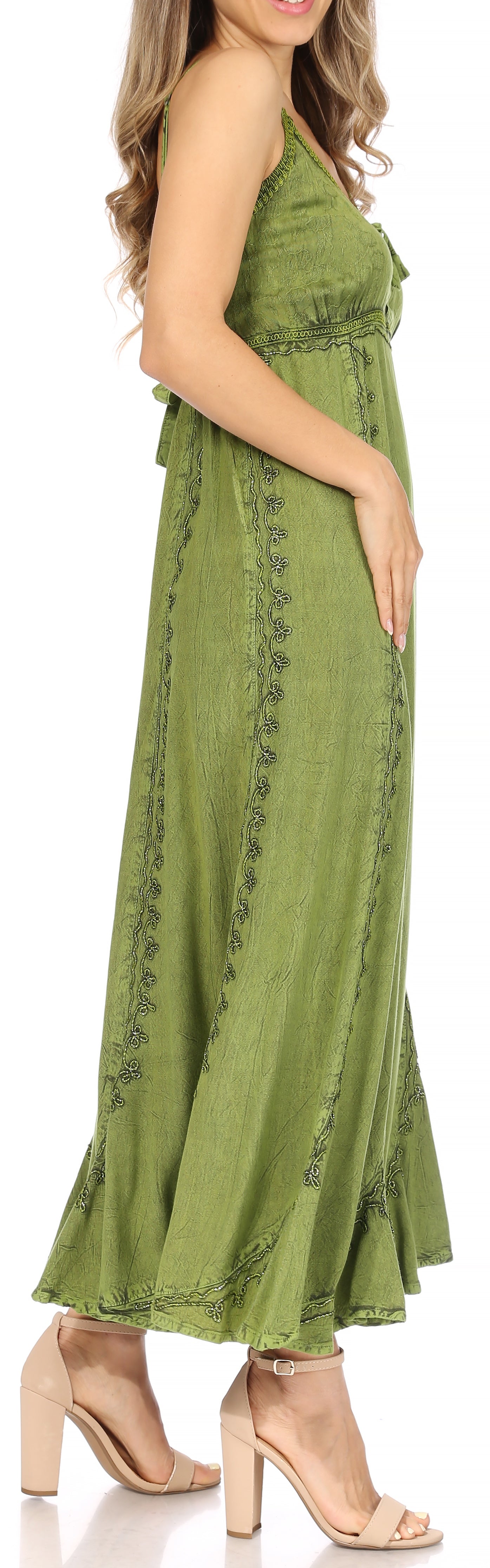 Green dress with lace details on a white background